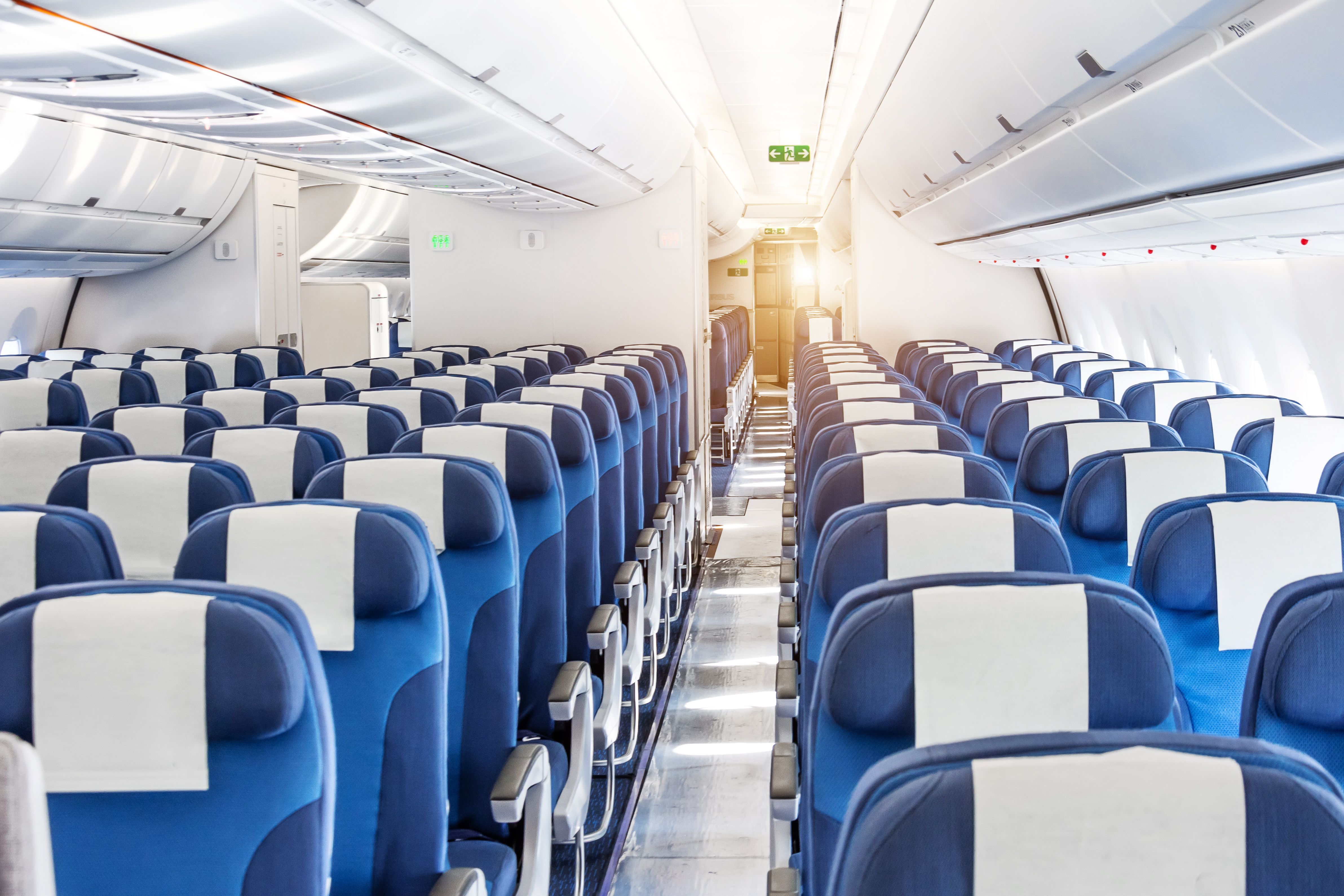 Blue airplane seats in a 3-3-3 configuration