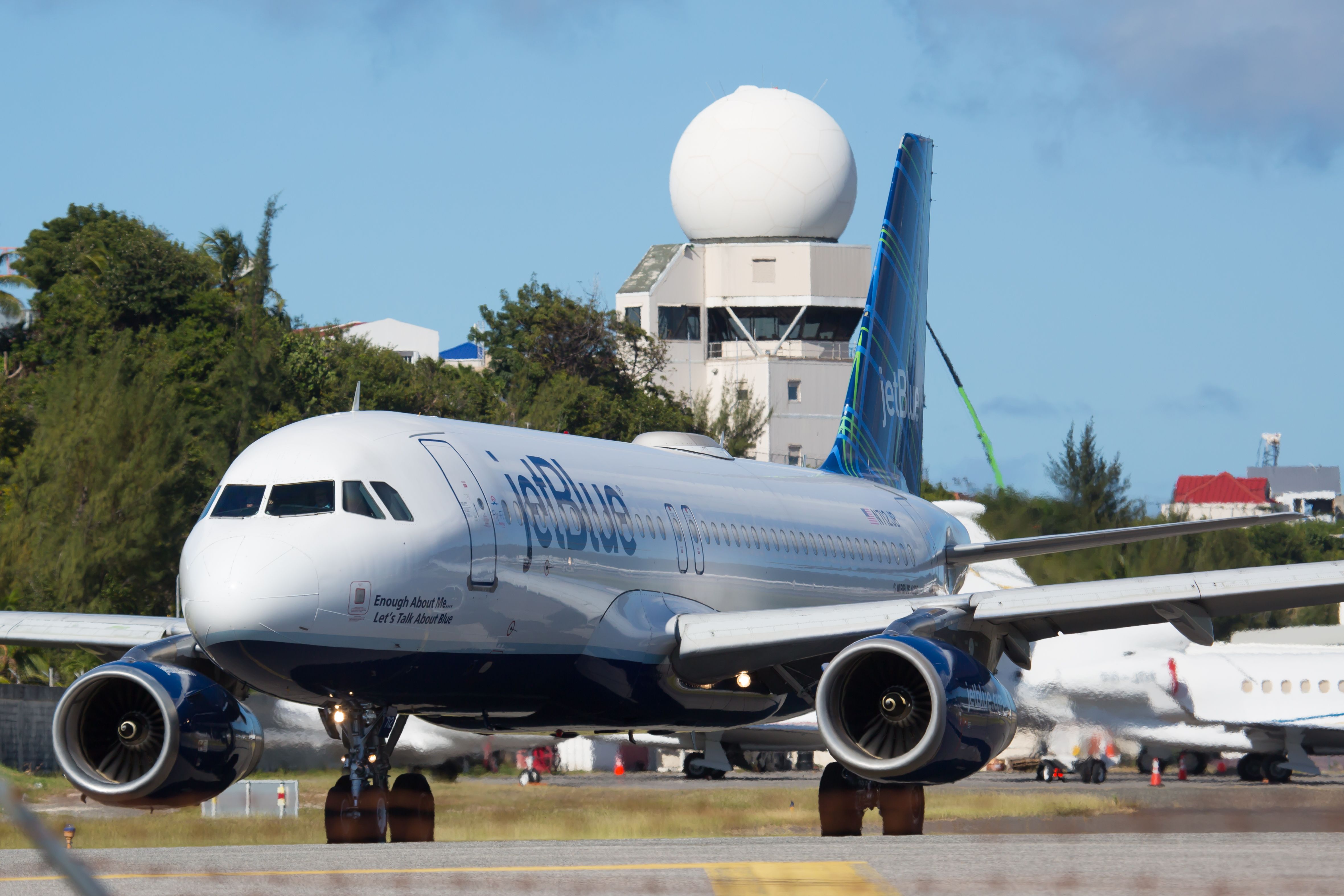 A JetBlue aircraft on the apron at Princess Juliana Airport in St. Maarten.