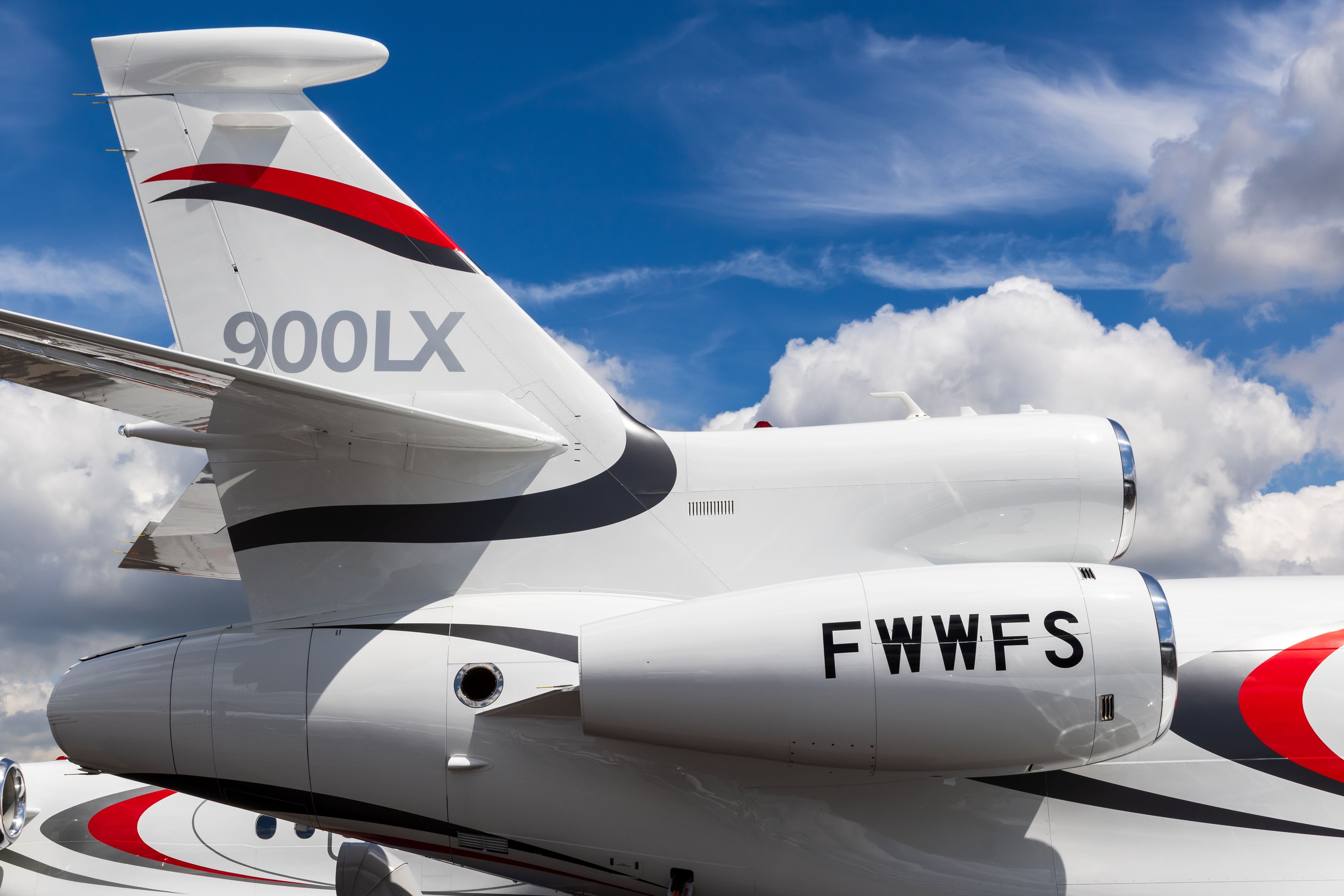 A close-up of the rear and side engines of a Dassault Falcon 900LX.