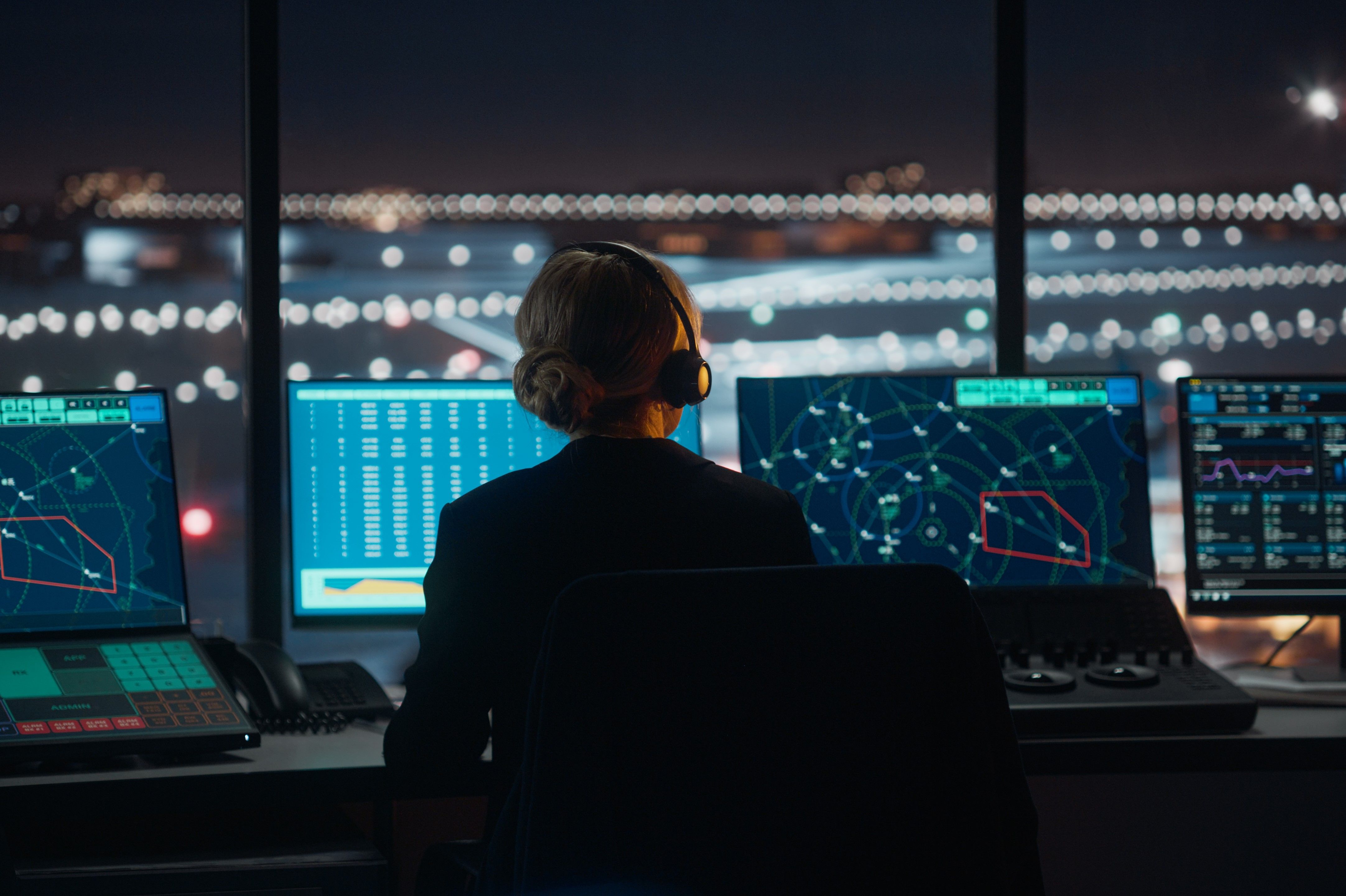 An air traffic controller working in the tower.