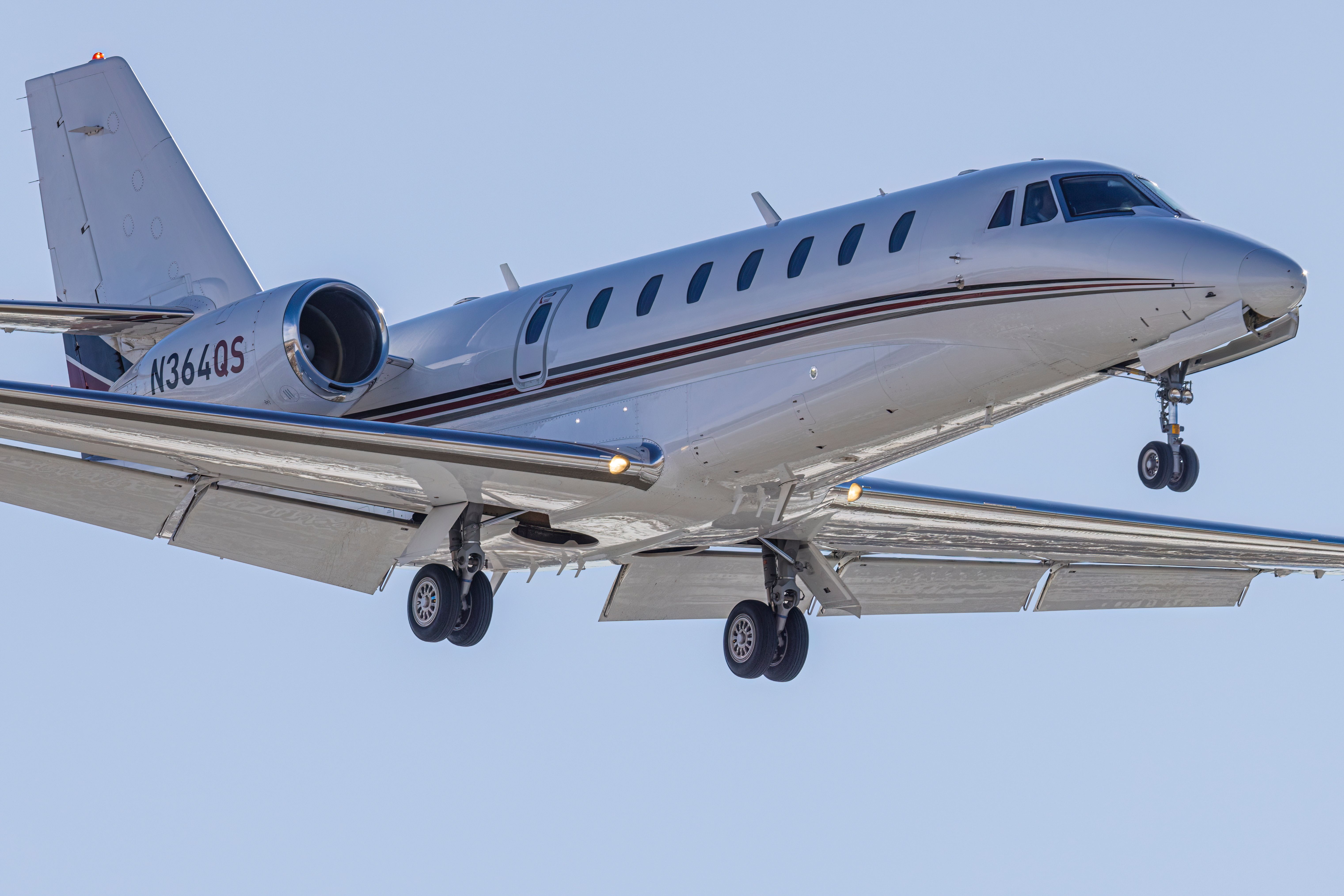 A closeup of a Cessna Citation Excel XLS flying in the sky.