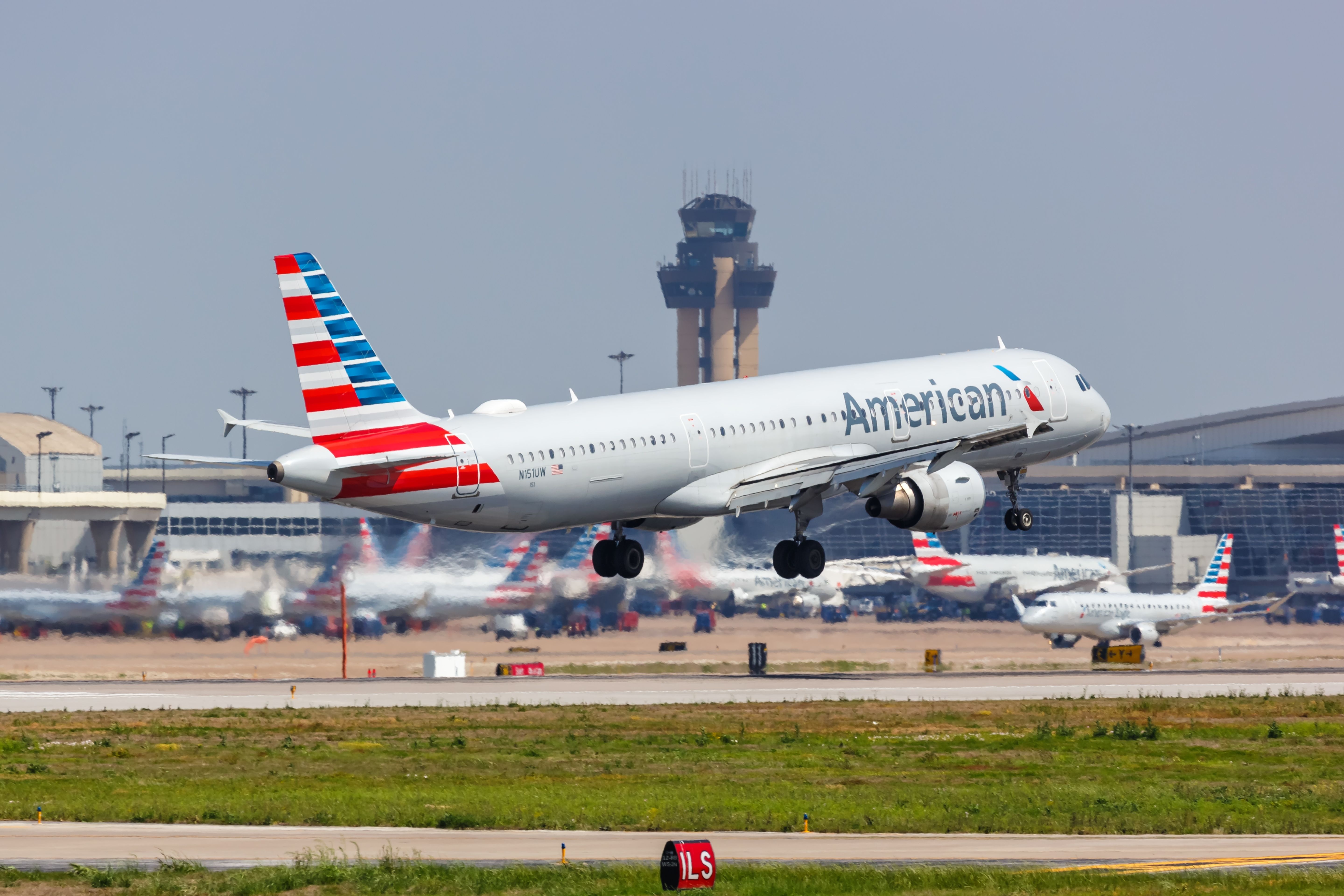 An American Airlines Airbus A321 taking off from DFW Airport.