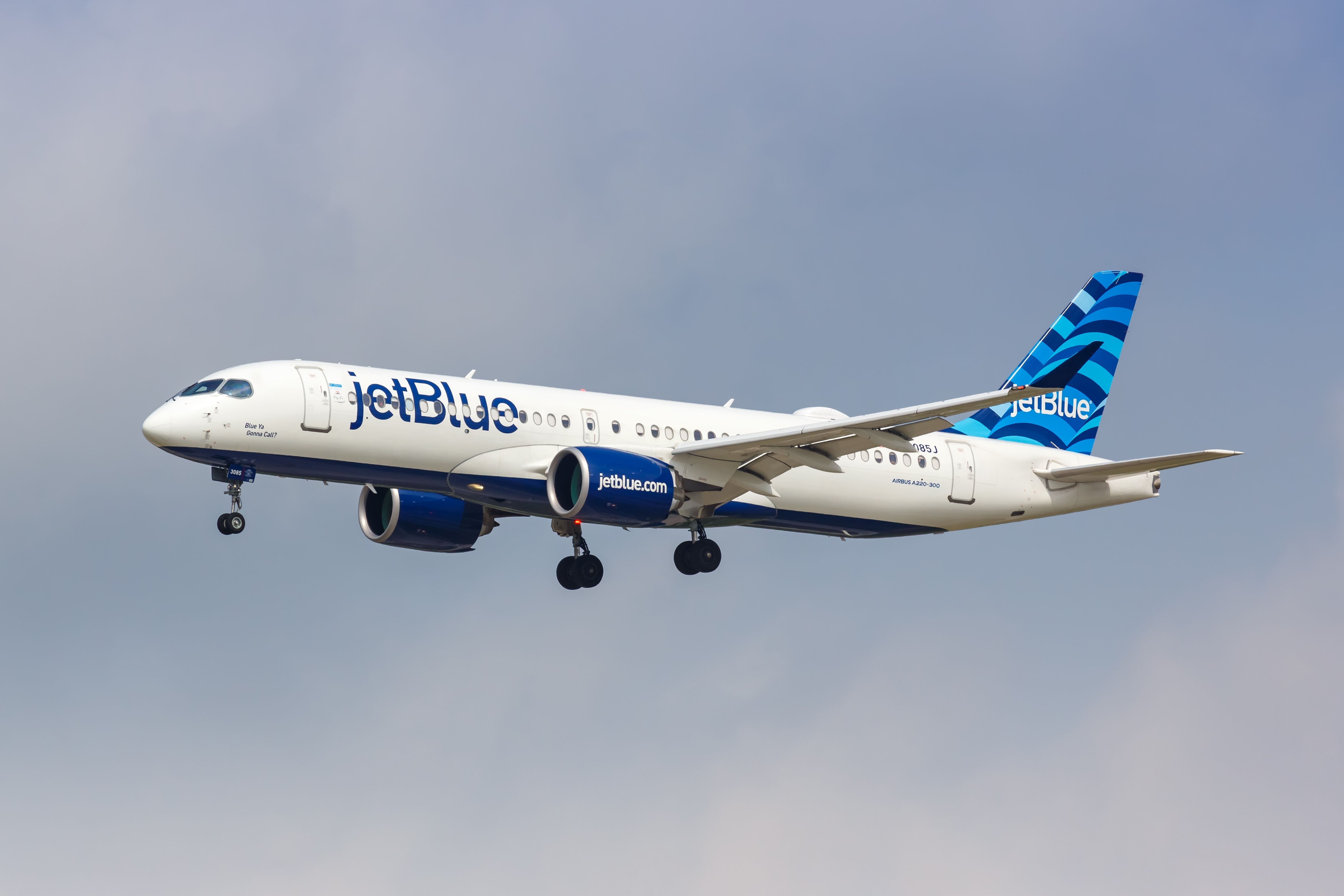 JetBlue Airways Airbus A220-300 landing at Dallas/Fort Worth International Airport.