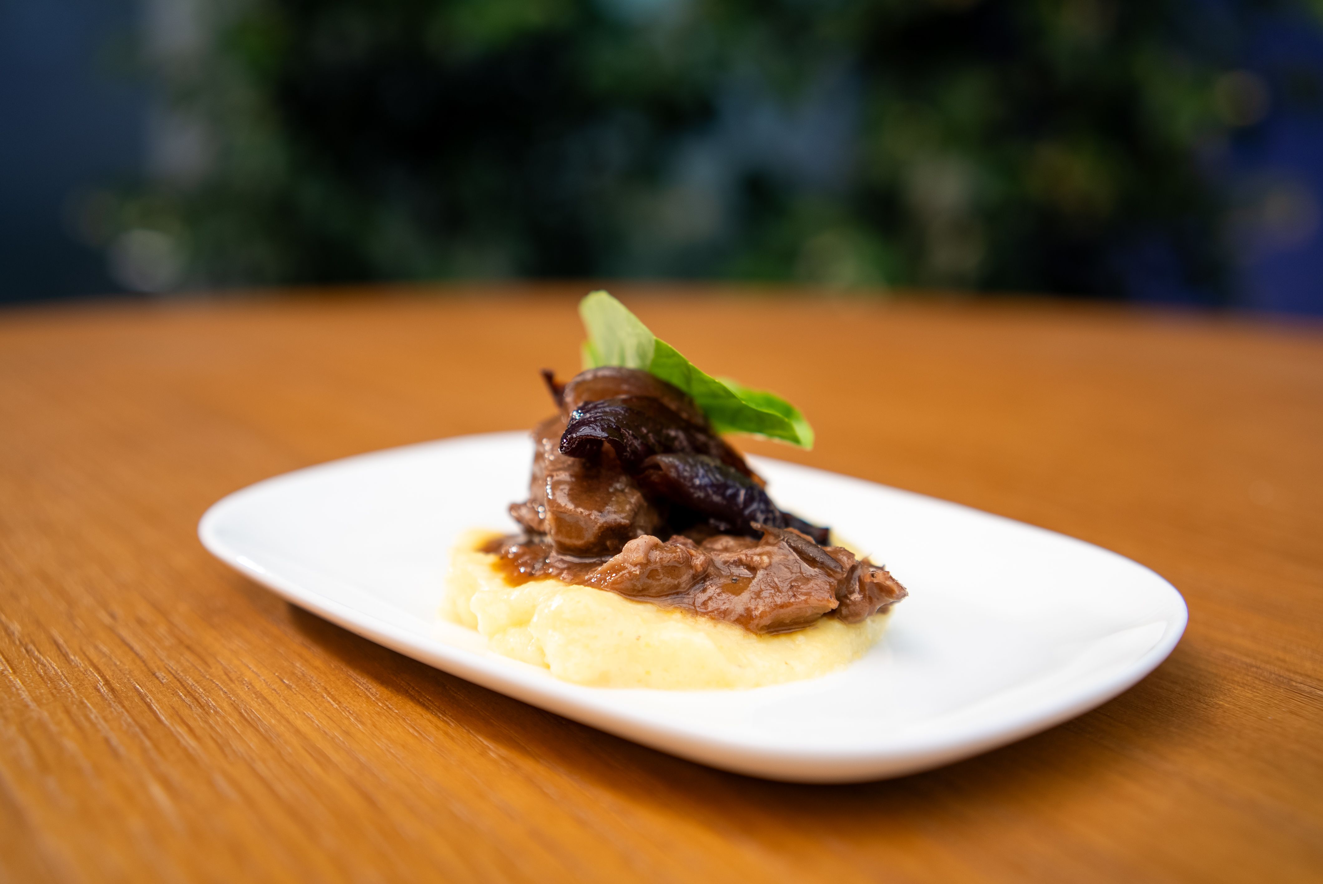 Air New Zealand Slow cooked wild Fiordland Venison with pancetta, parmesan polenta and balsamic roasted red onions