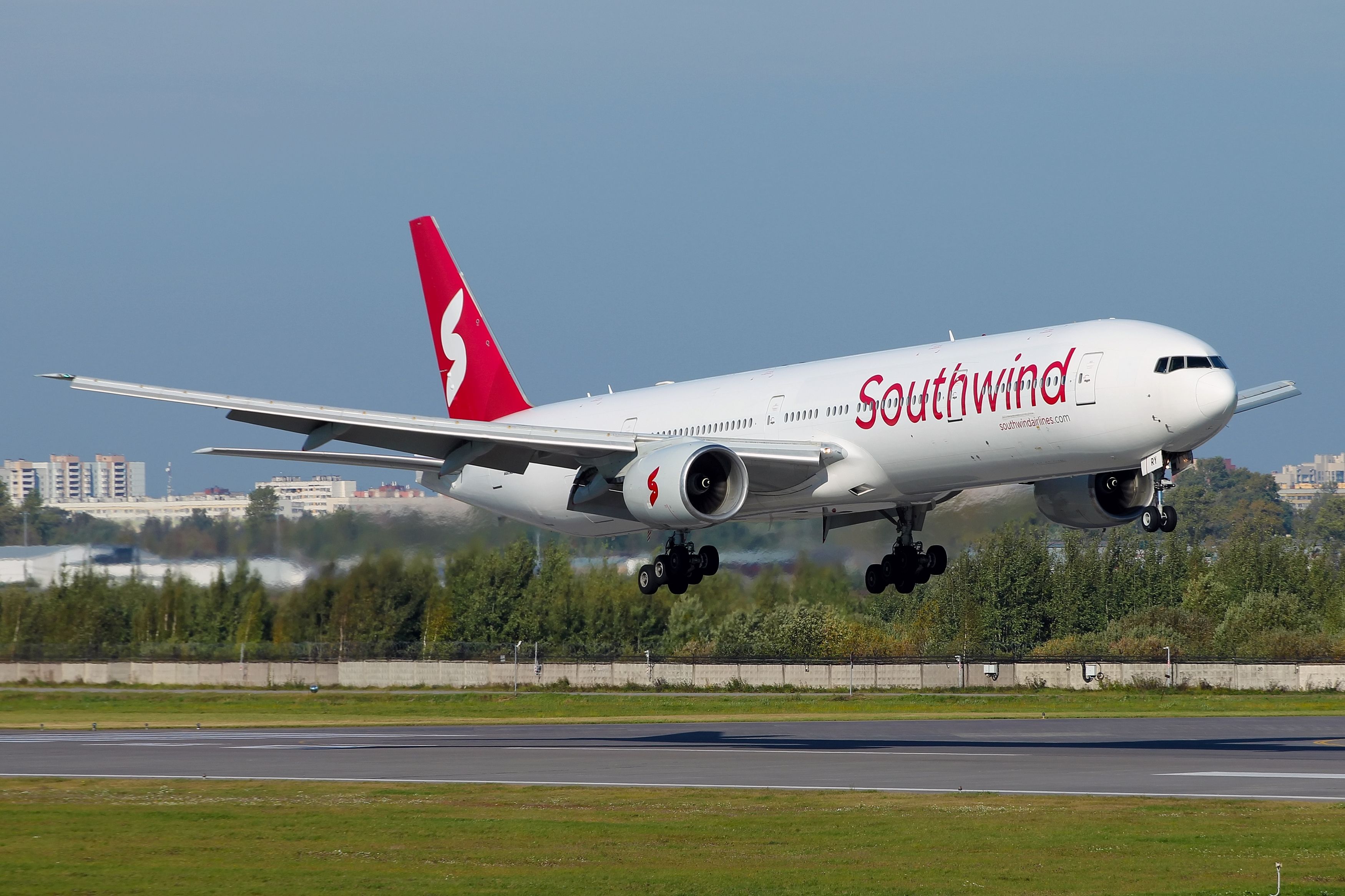 Southwind Airlines Boeing 777-300 landing at LED shutterstock_2376964279