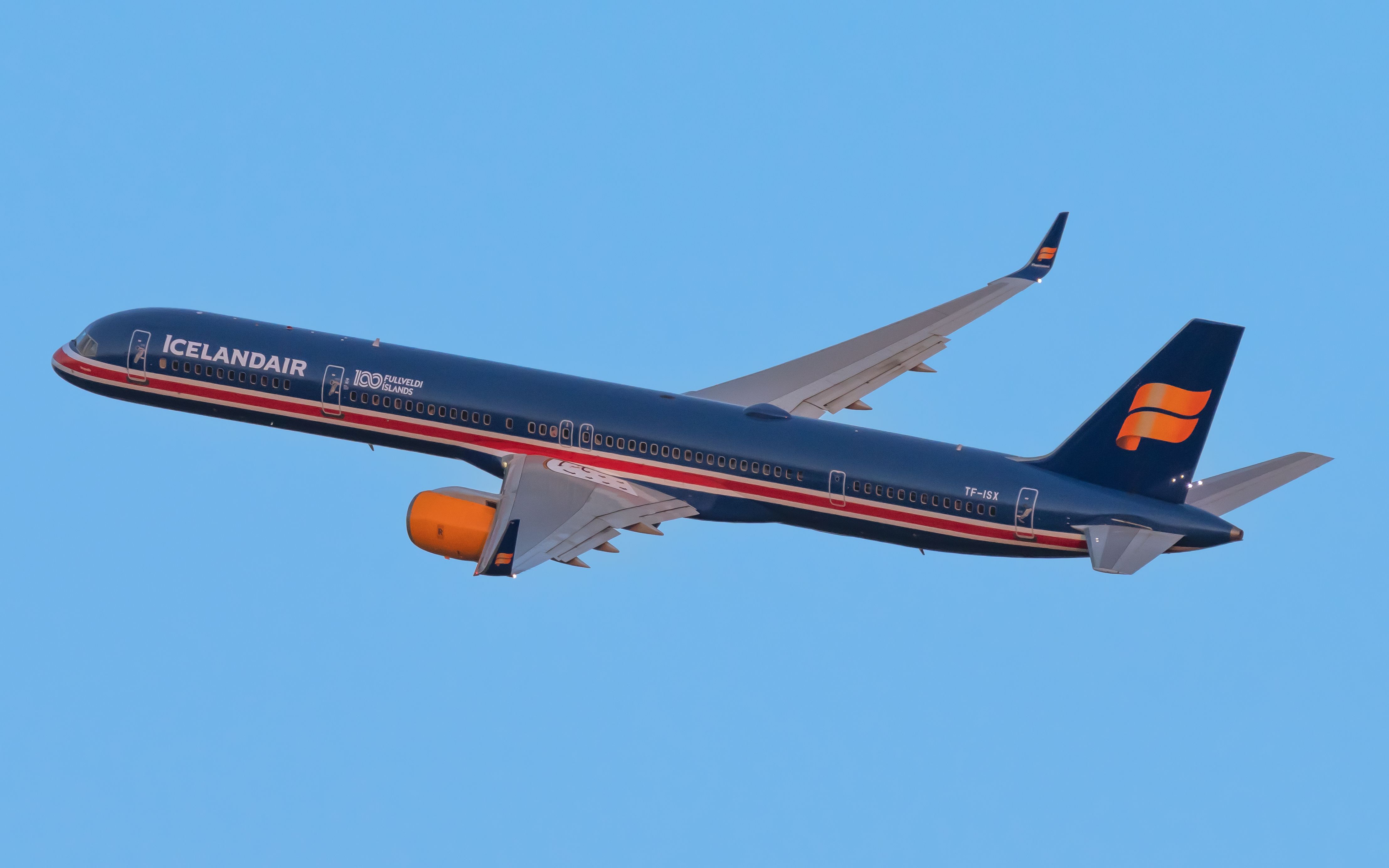 An Icelandair Boeing 757-300 in 100 Years Independence Livery flying in the sky.