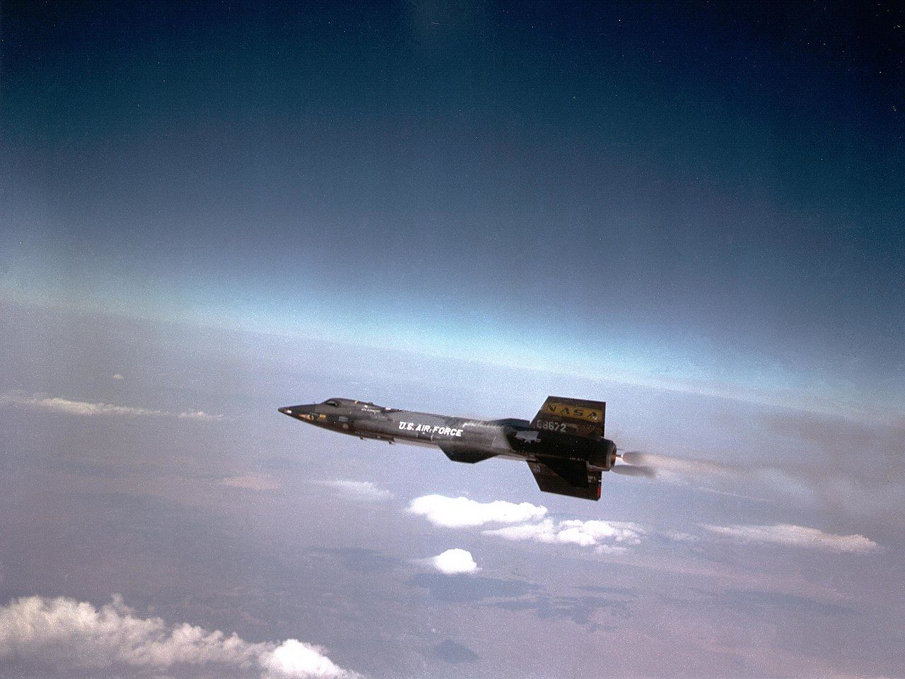 A North American X-15 flying high above the clouds.