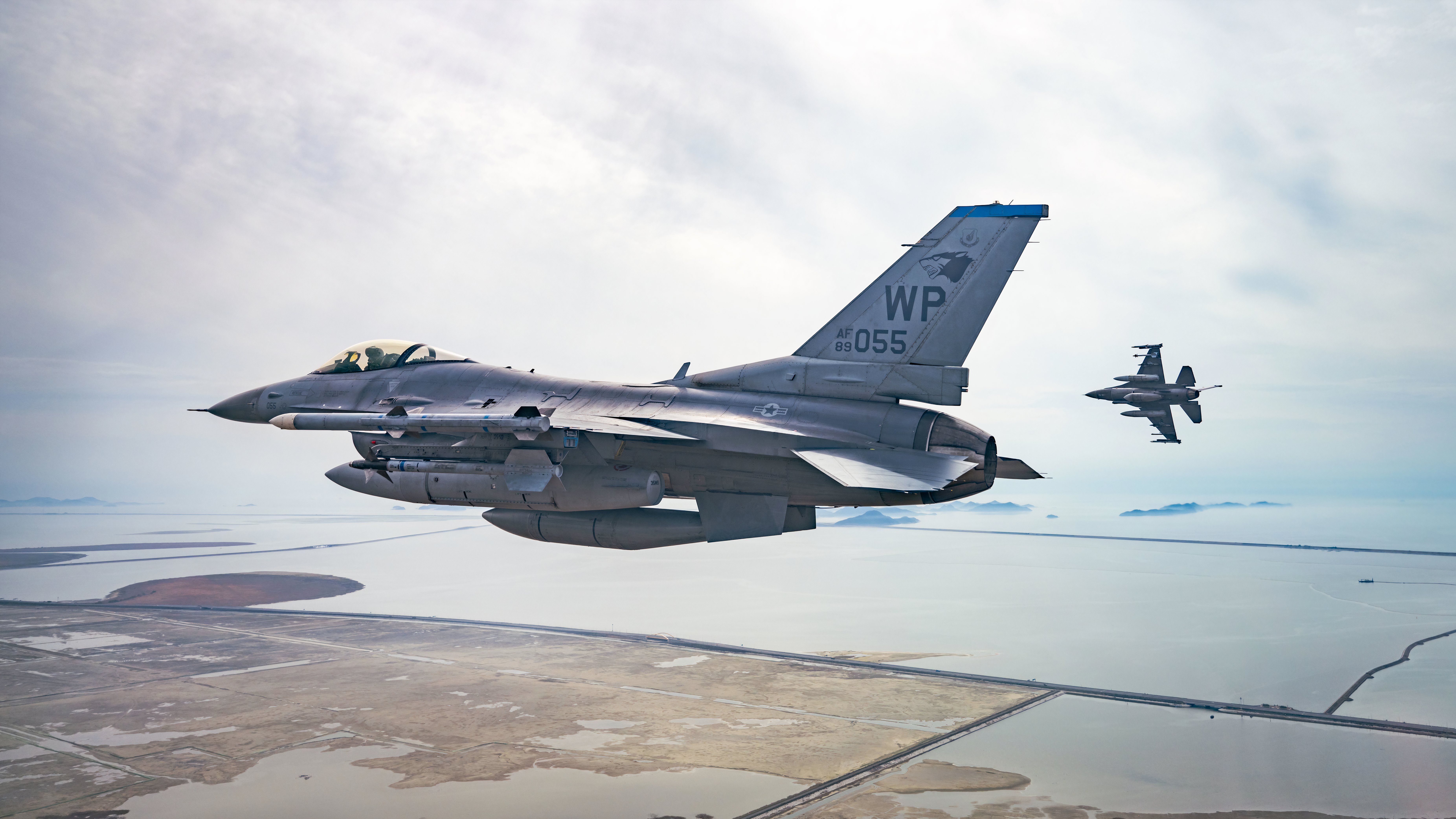 Two F-16 Fighting Falcons from the 35th Fighter Squadron, fly over South Korea’s southern coast, 