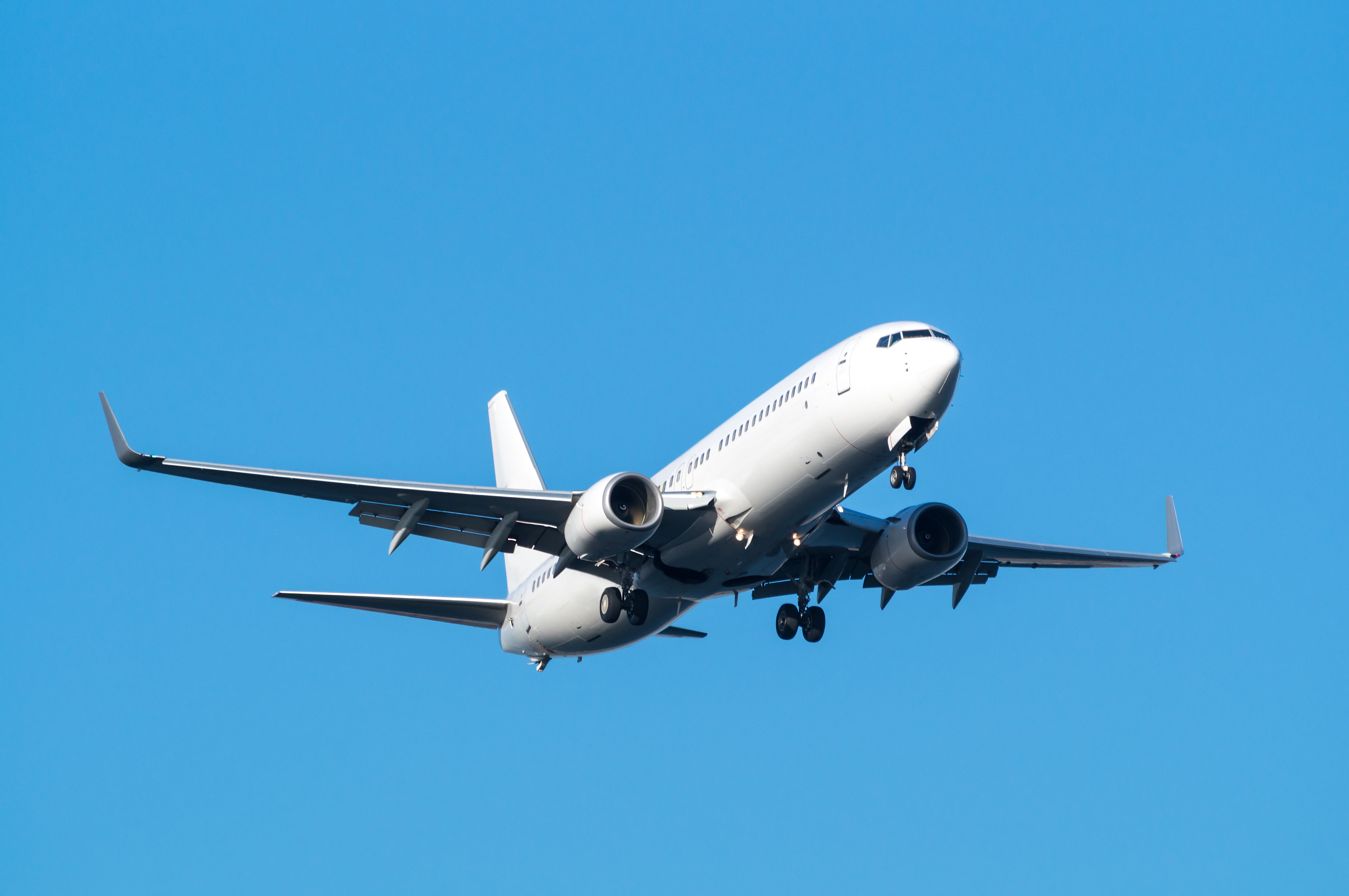 All-white Boeing 737-800 landing at an airportshutterstock_218538742