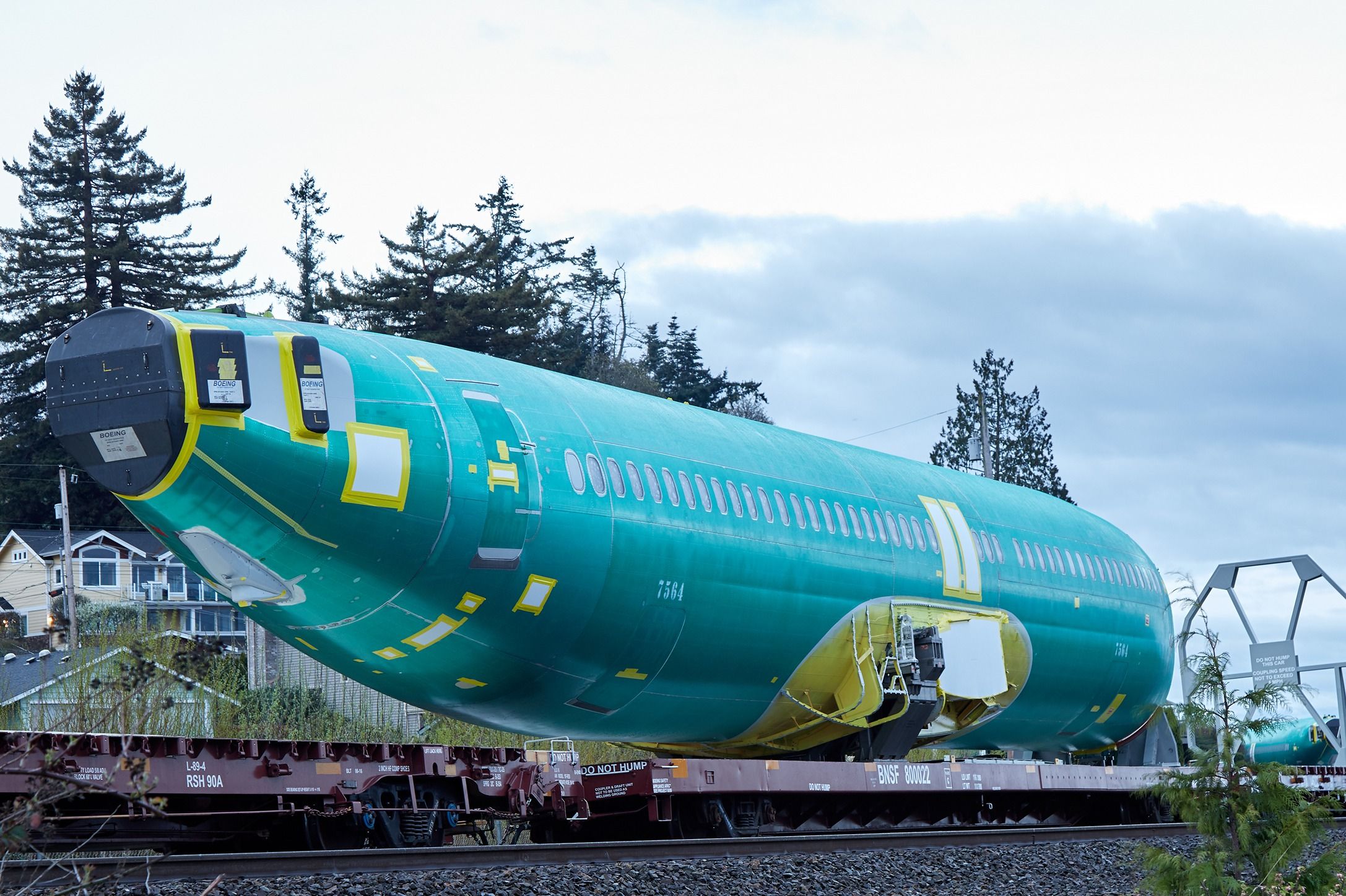 Boeing 737 fuselage on a train shutterstock_1360438619
