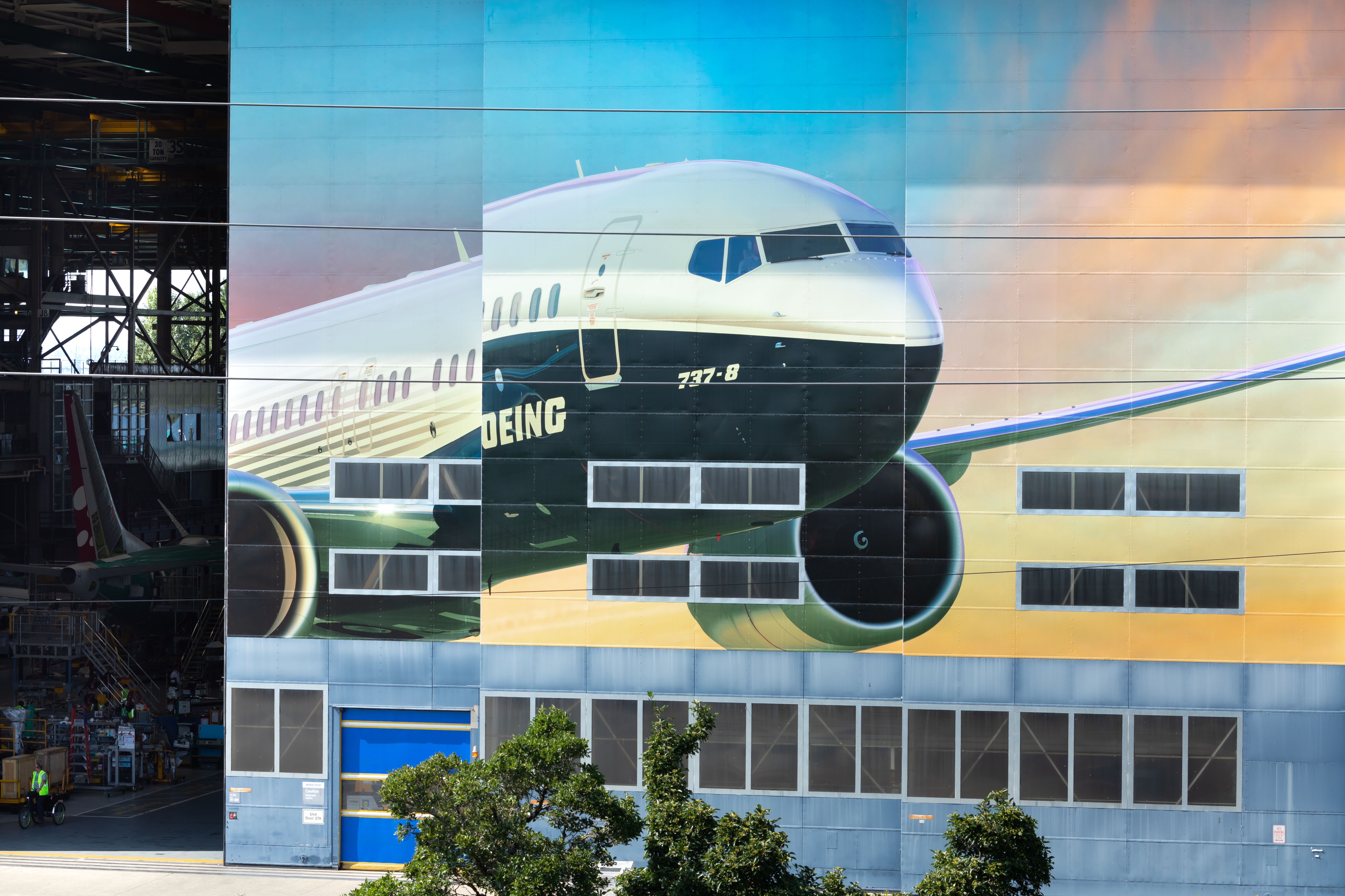 Boeing 737 MAX 8 rendering on the doors of Boeing's factory shutterstock_1478552264