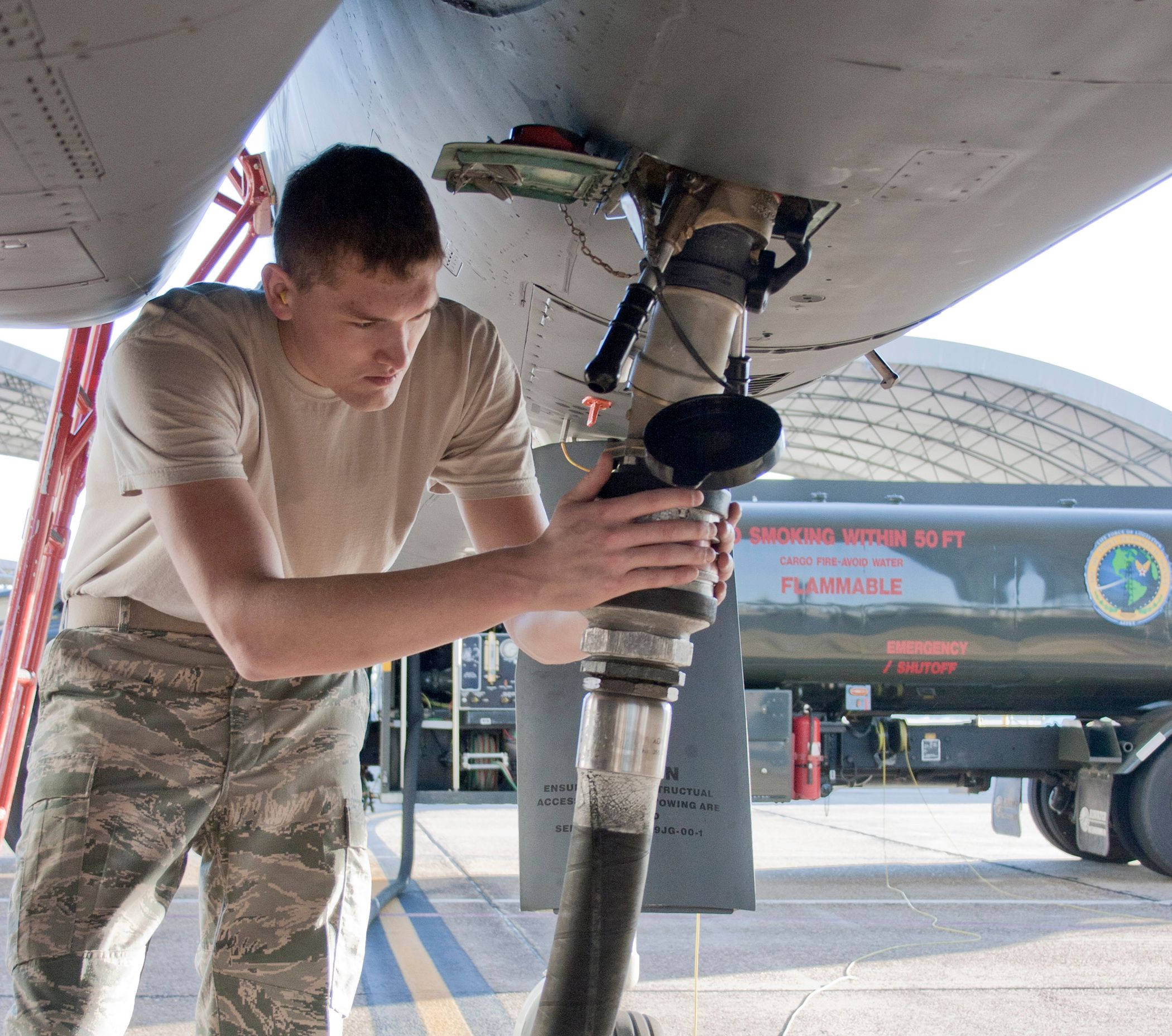 Maintenance crew attends to an F-15