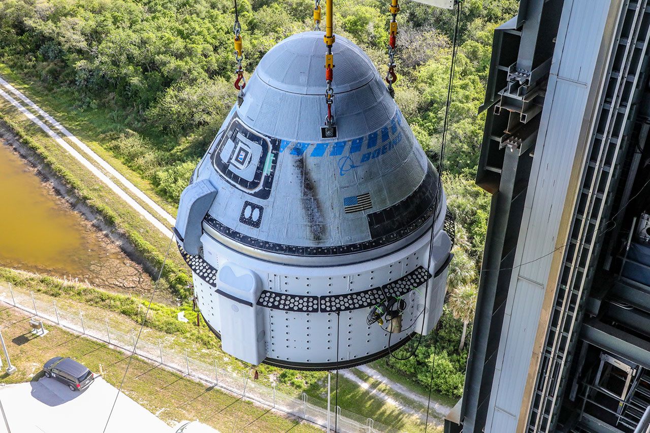 Starliner spacecraft is hoisted into United Launch Alliance’s Vertical Integration Facility