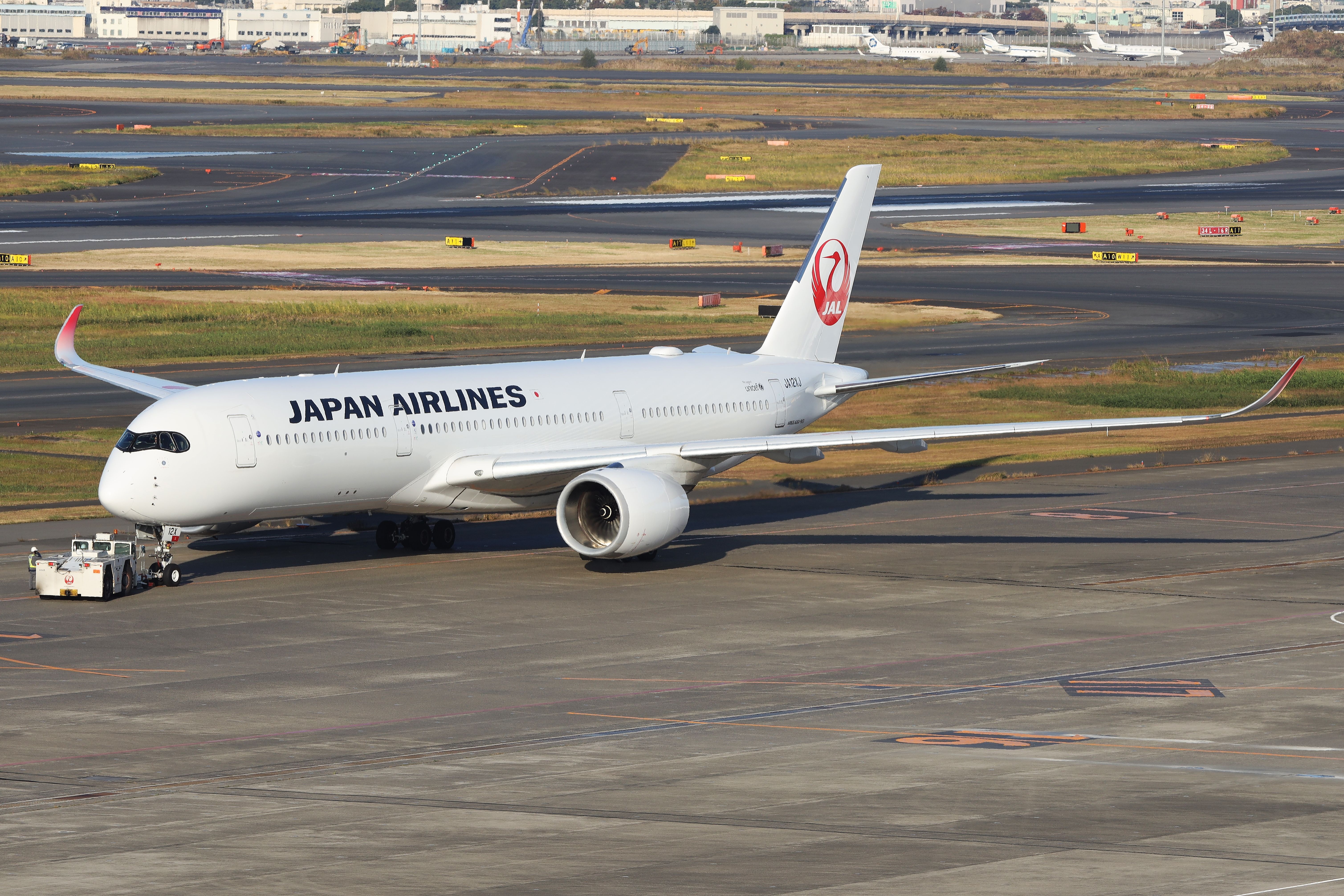 Japan Airlines Airbus A350-900 being pushed back at HND shutterstock_2289767489