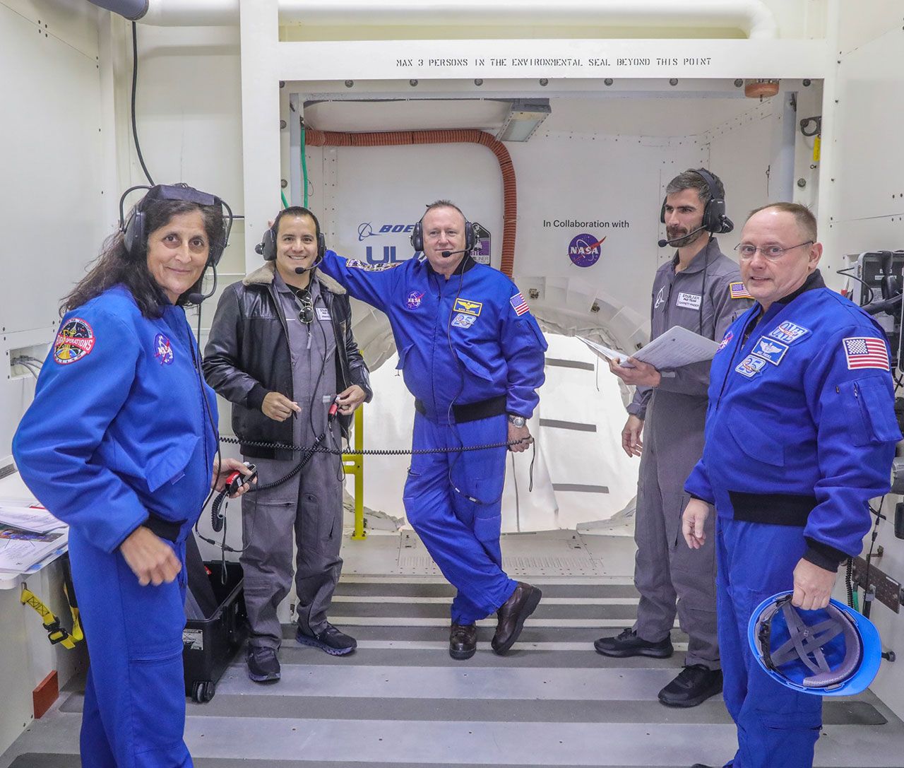 NASA astronauts Suni Williams and Butch Wilmore with team members