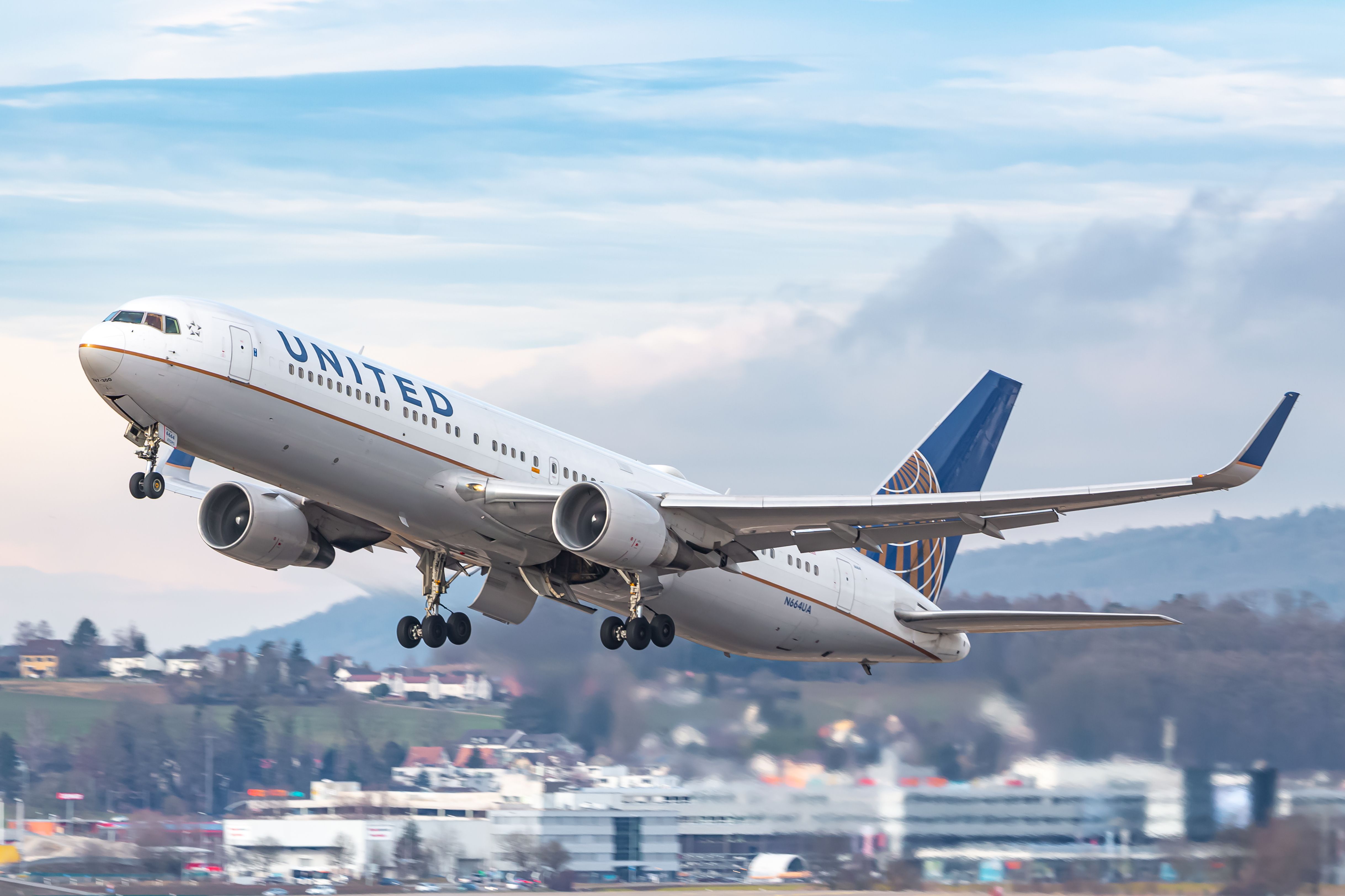 Boeing 767-322/ER N664UA of United Airlines takes off.