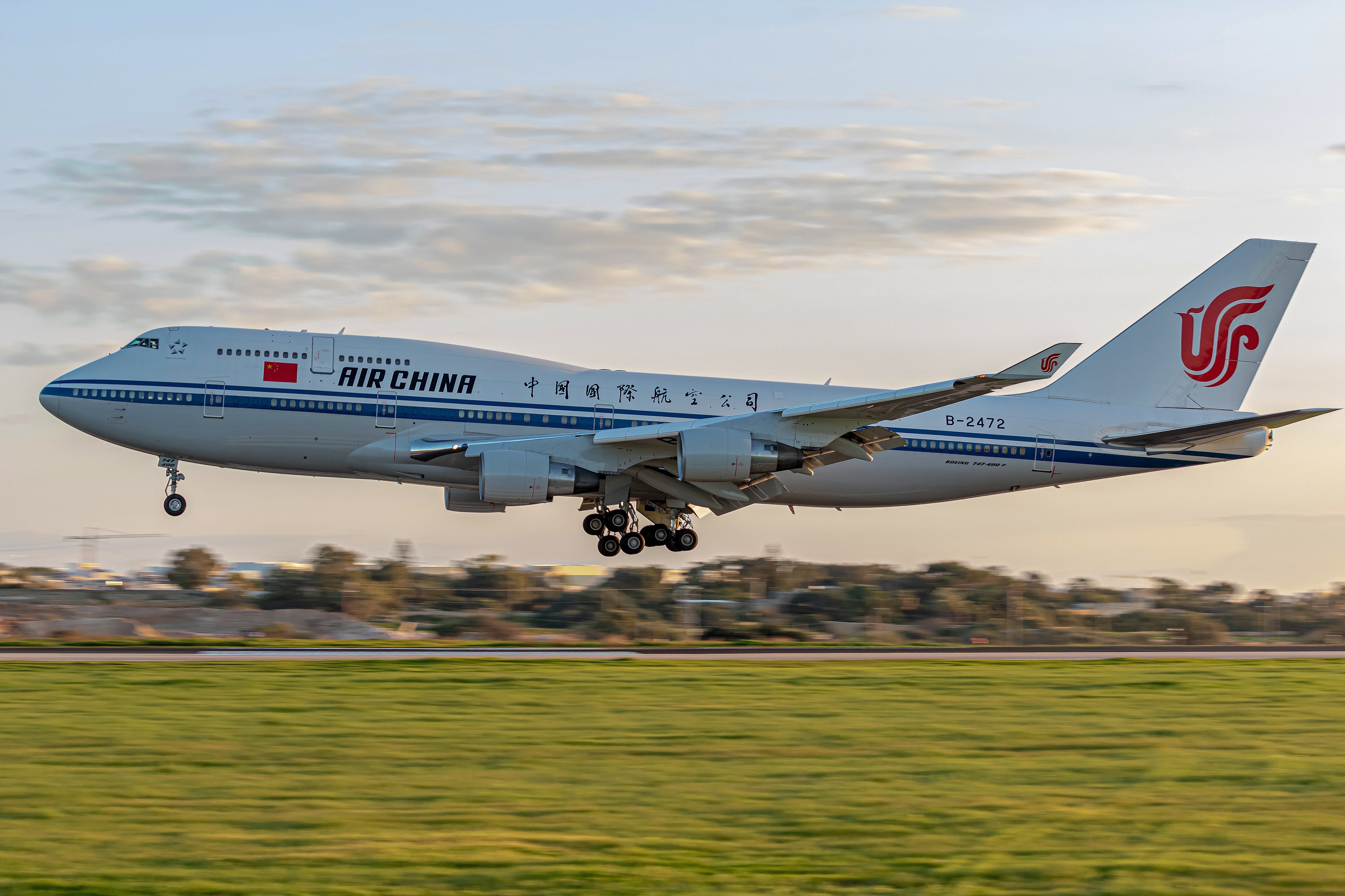 A Boeing 747-400 Air China passenger plane is taking off from the runway at malta international airport