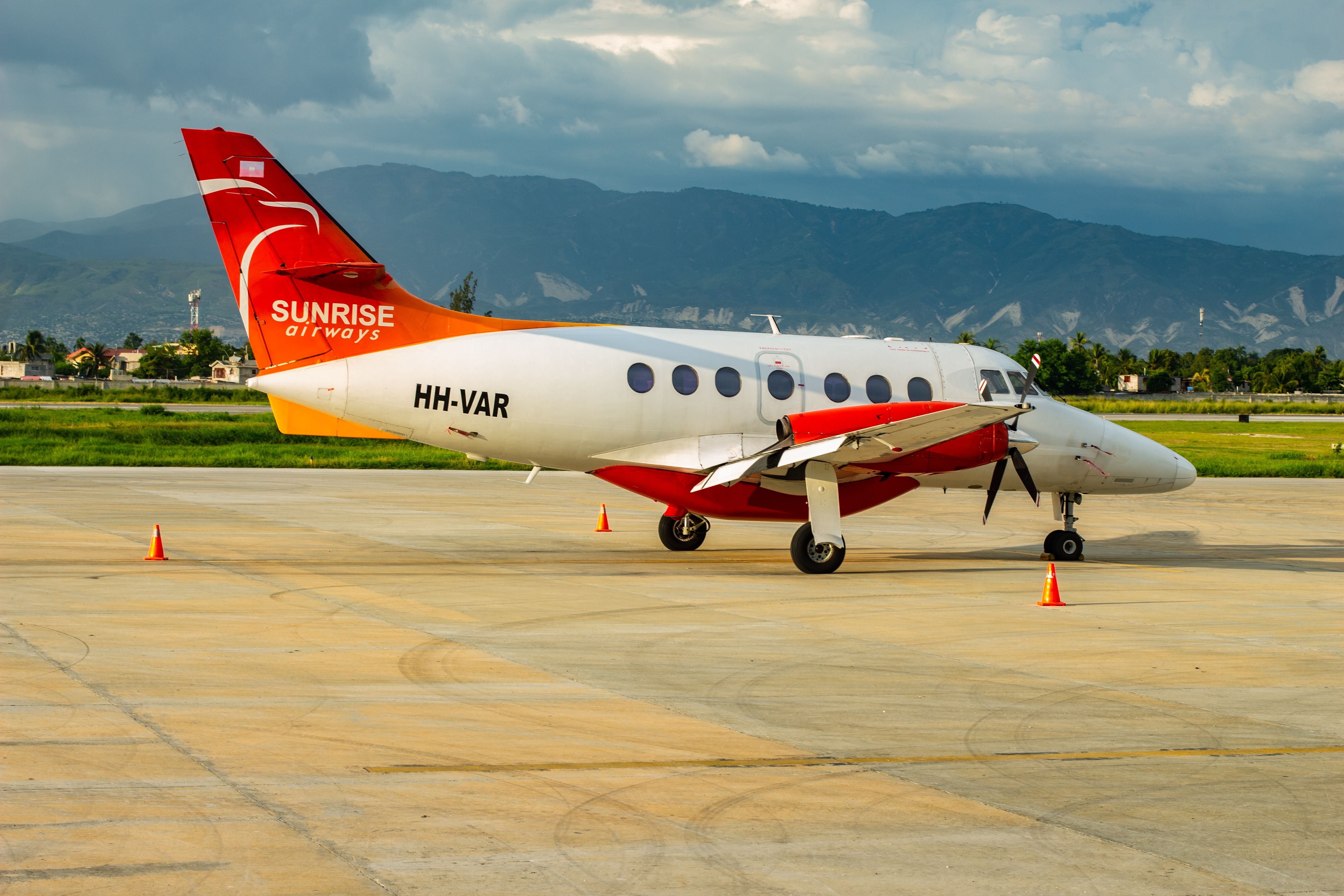 A Sunrise Airways Embraer parked at PAP airport