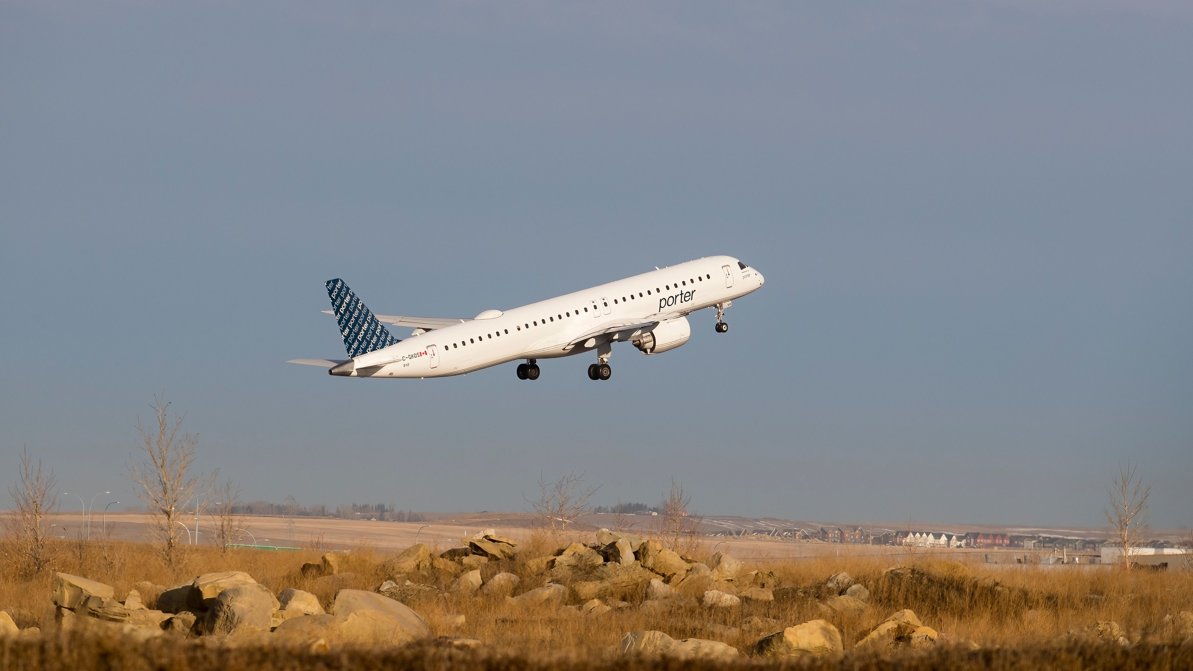 Porter Airlines Embraer E195-E2 taking off from Calgary International Airport.