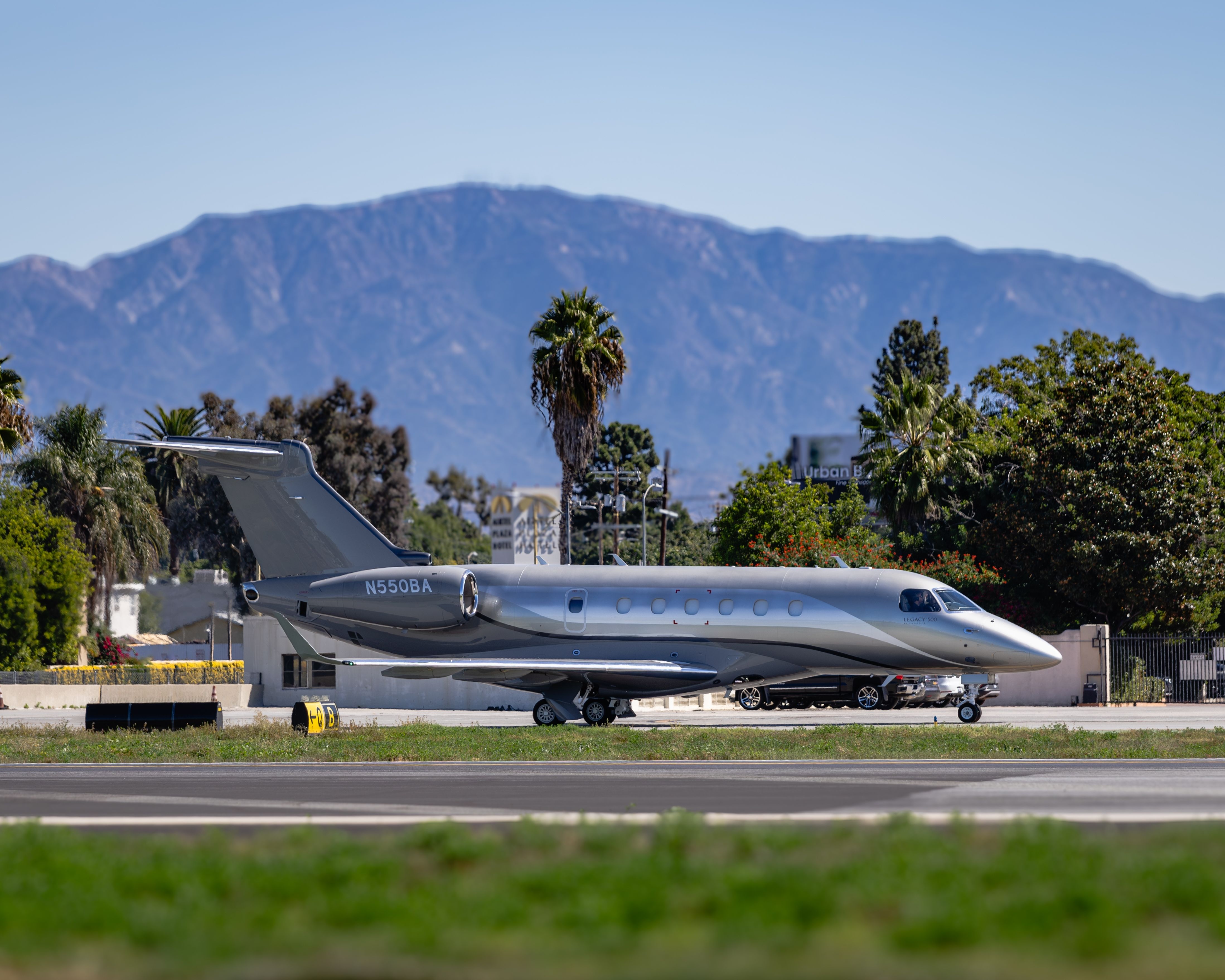 A Legacy 500 built by Embraer in Brazil is seen taxing down for departure.