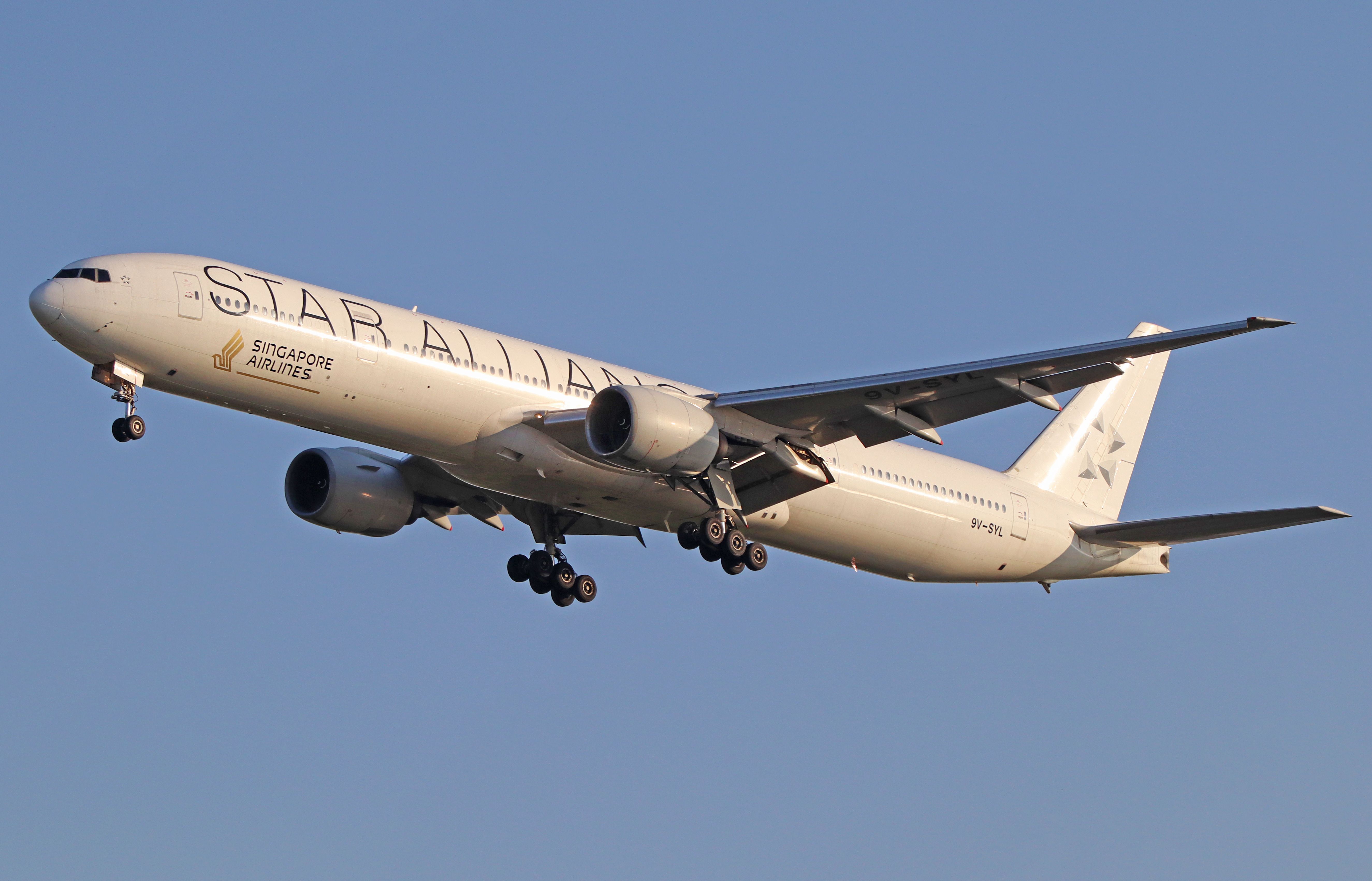 Singapore Airlines Boeing 777-300ER with Star Alliance landing at BKK shutterstock_1591110865