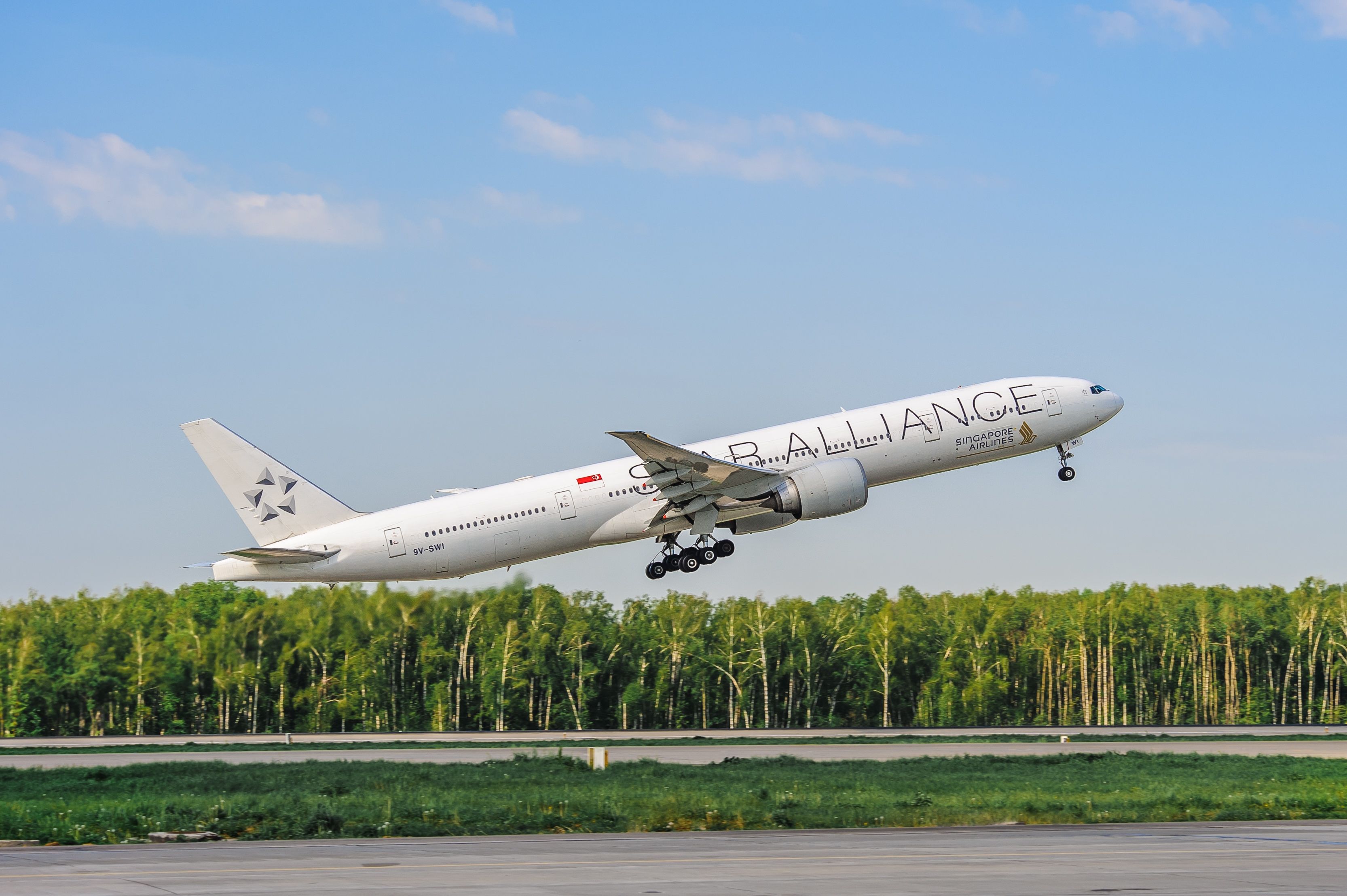 Singapore Airlines Boeing 777-300ER in Star Alliance livery departing Moscow shutterstock_2149326671