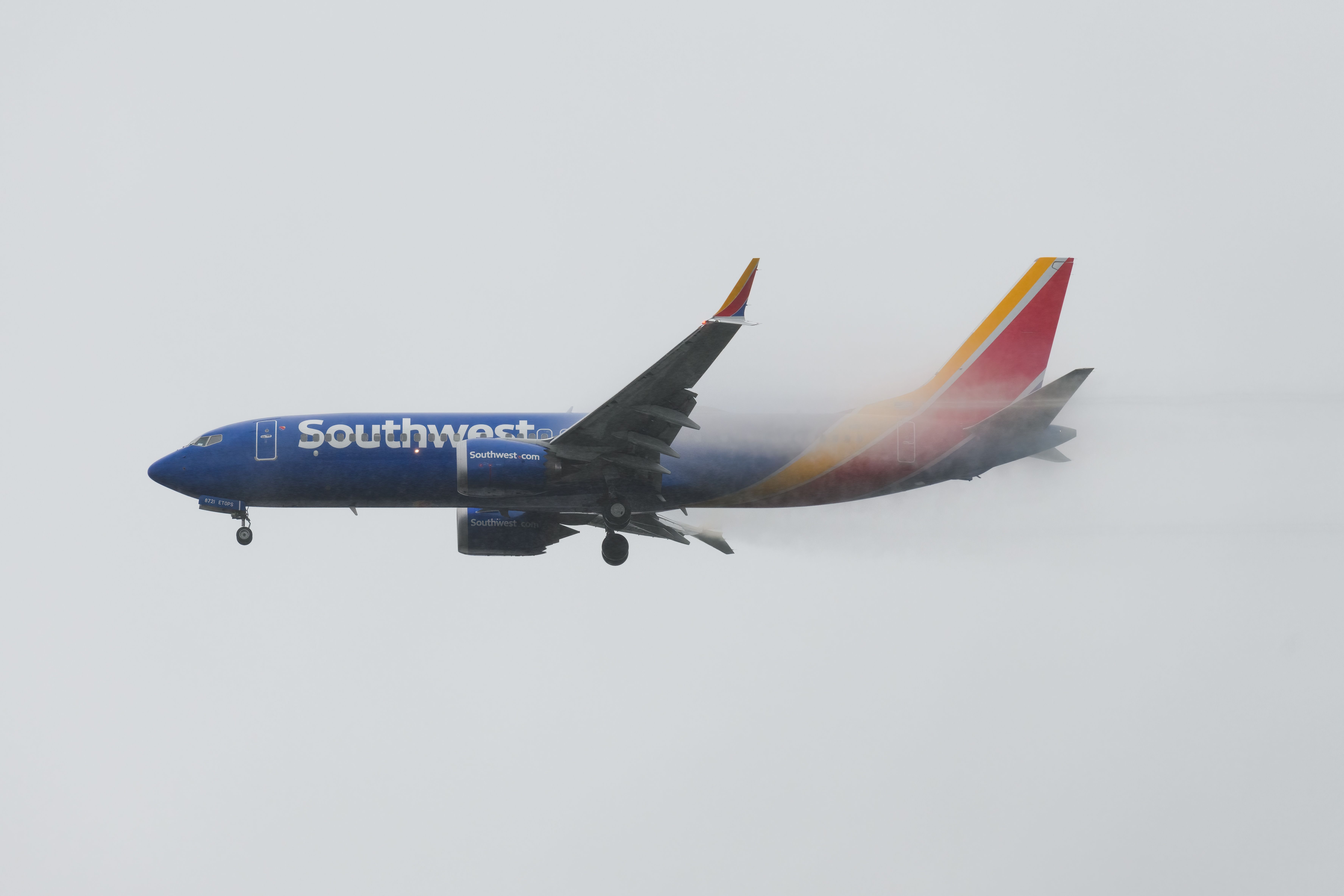 Southwest Airlines Boeing 737 MAX 8 landing in the rain at SEA shutterstock_2131011197