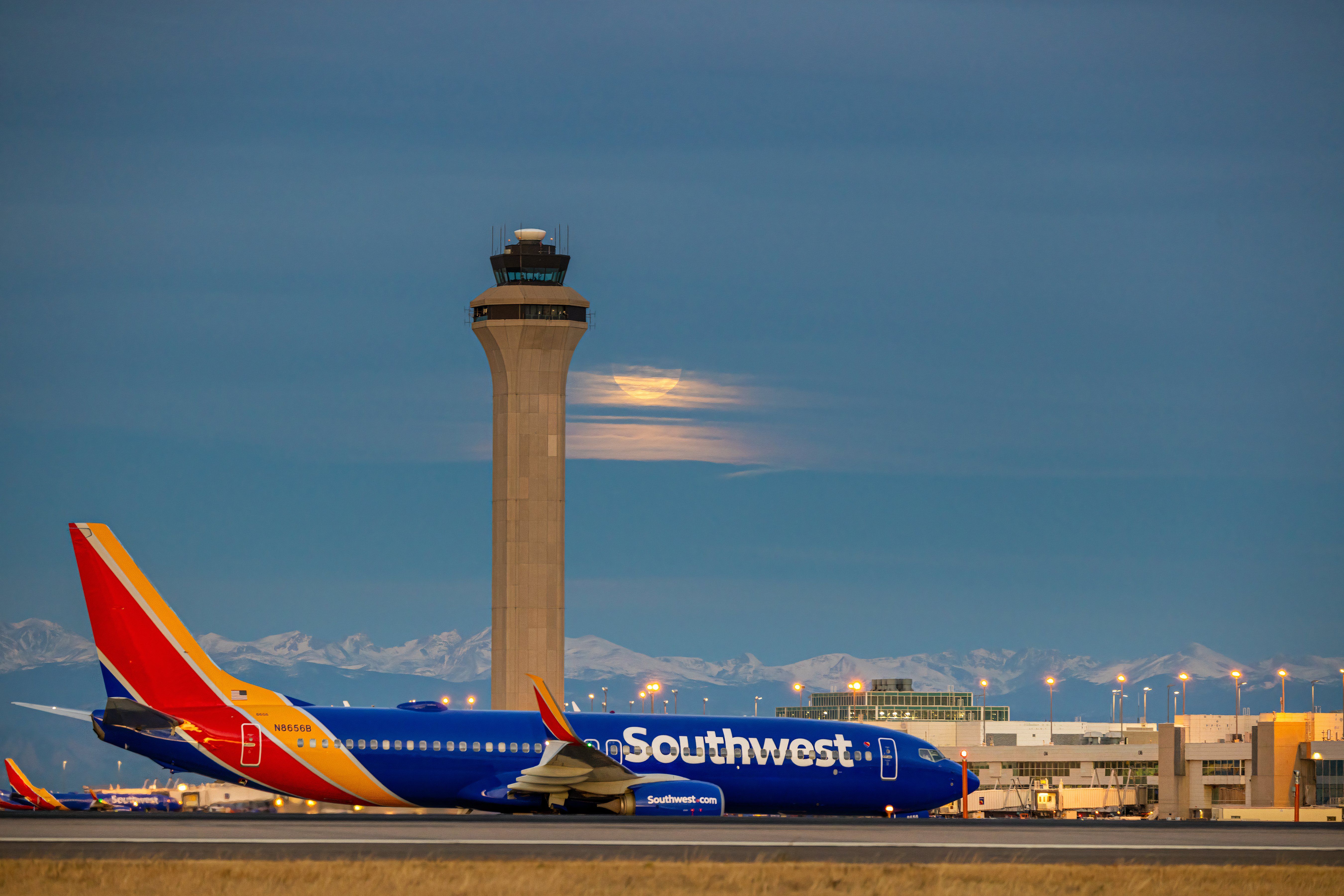 A Southwest Airlines plane in front of a full moon