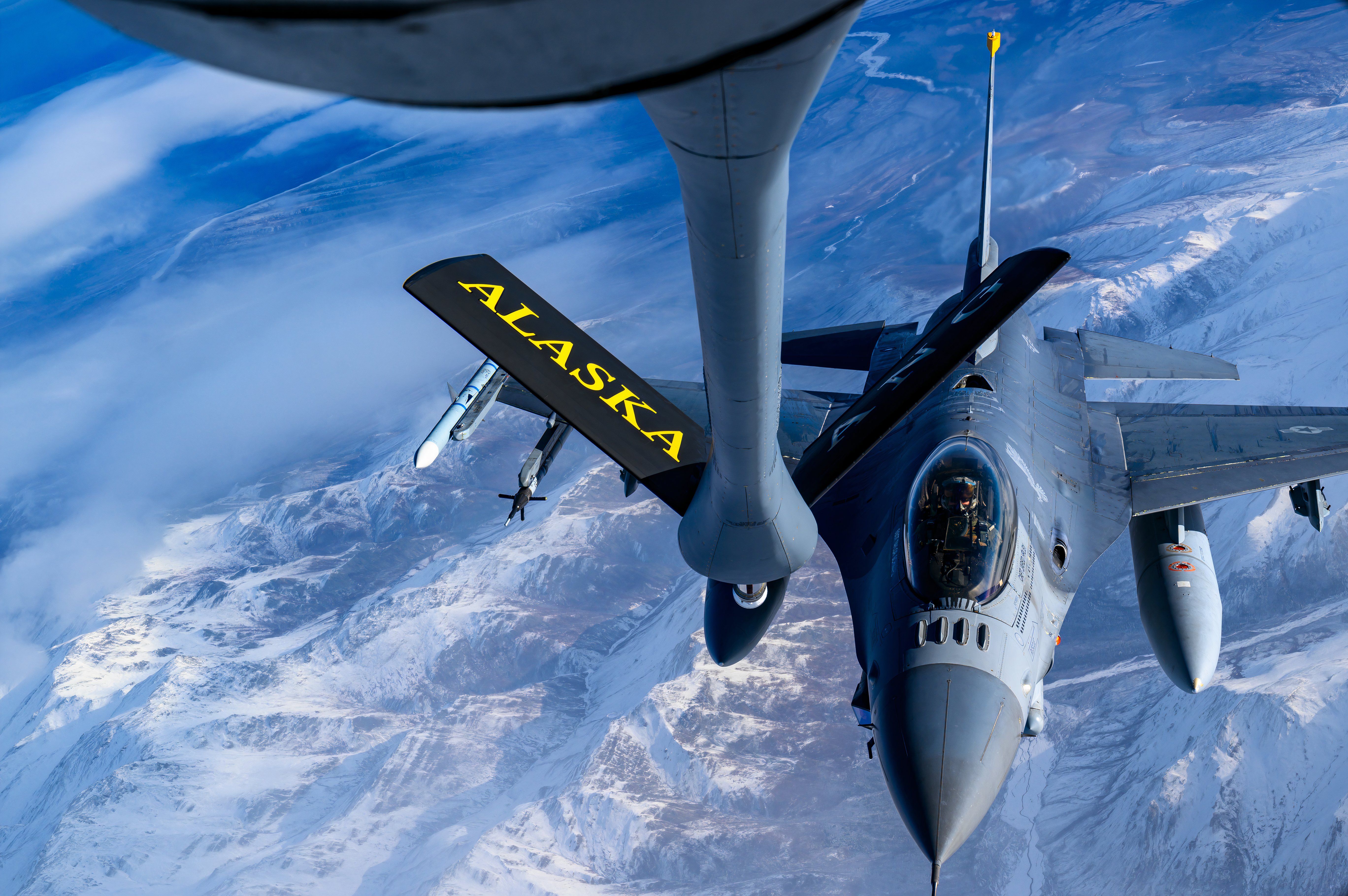 n F-16 Fighting Falcon moves into position to receive fuel from a 168th Air Refueling Wing KC-135 Stratotanker