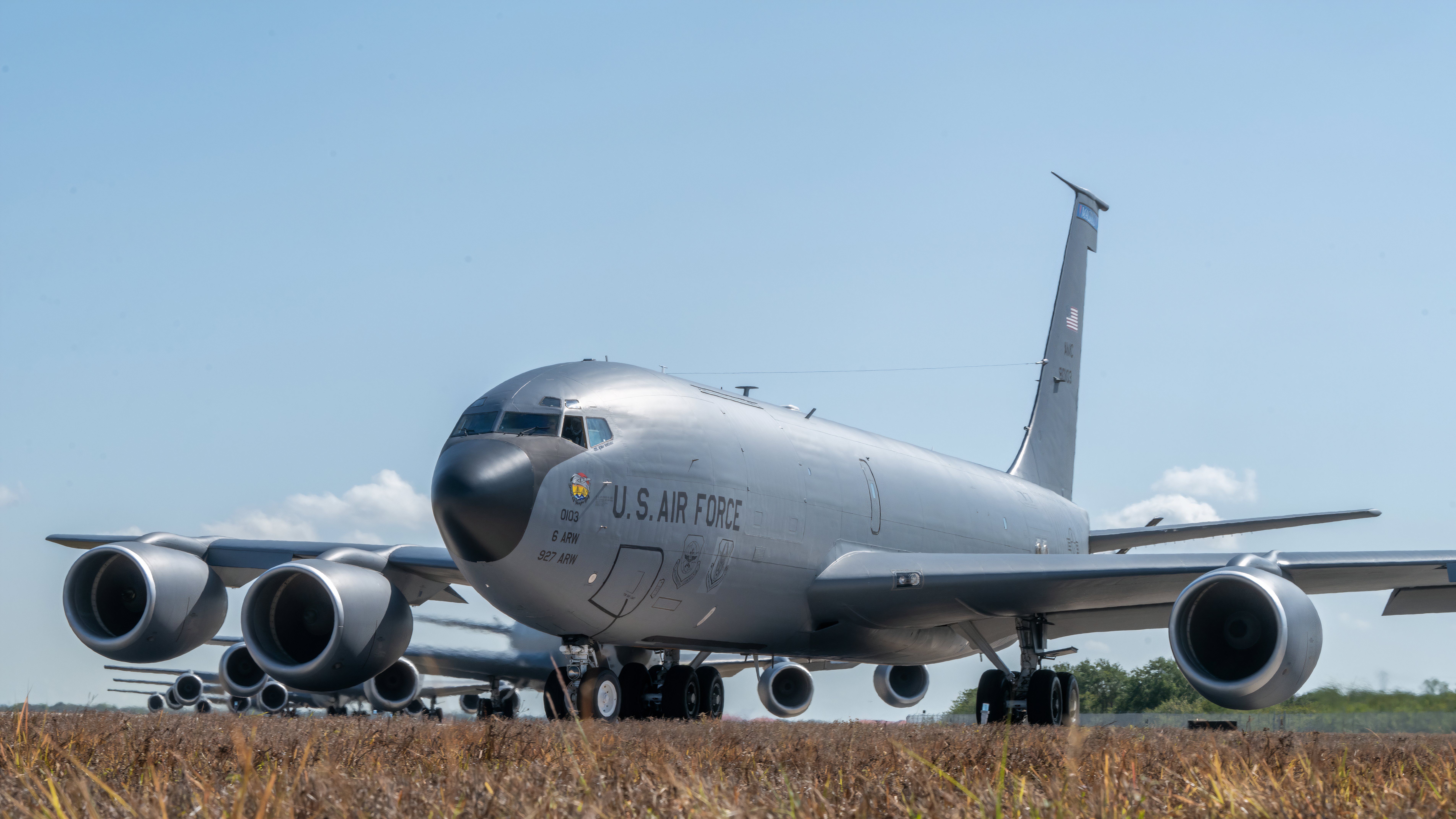 KC-135 Stratotankers assigned to the 6th and 927th Air Refueling Wings taxi in formation on the flightline