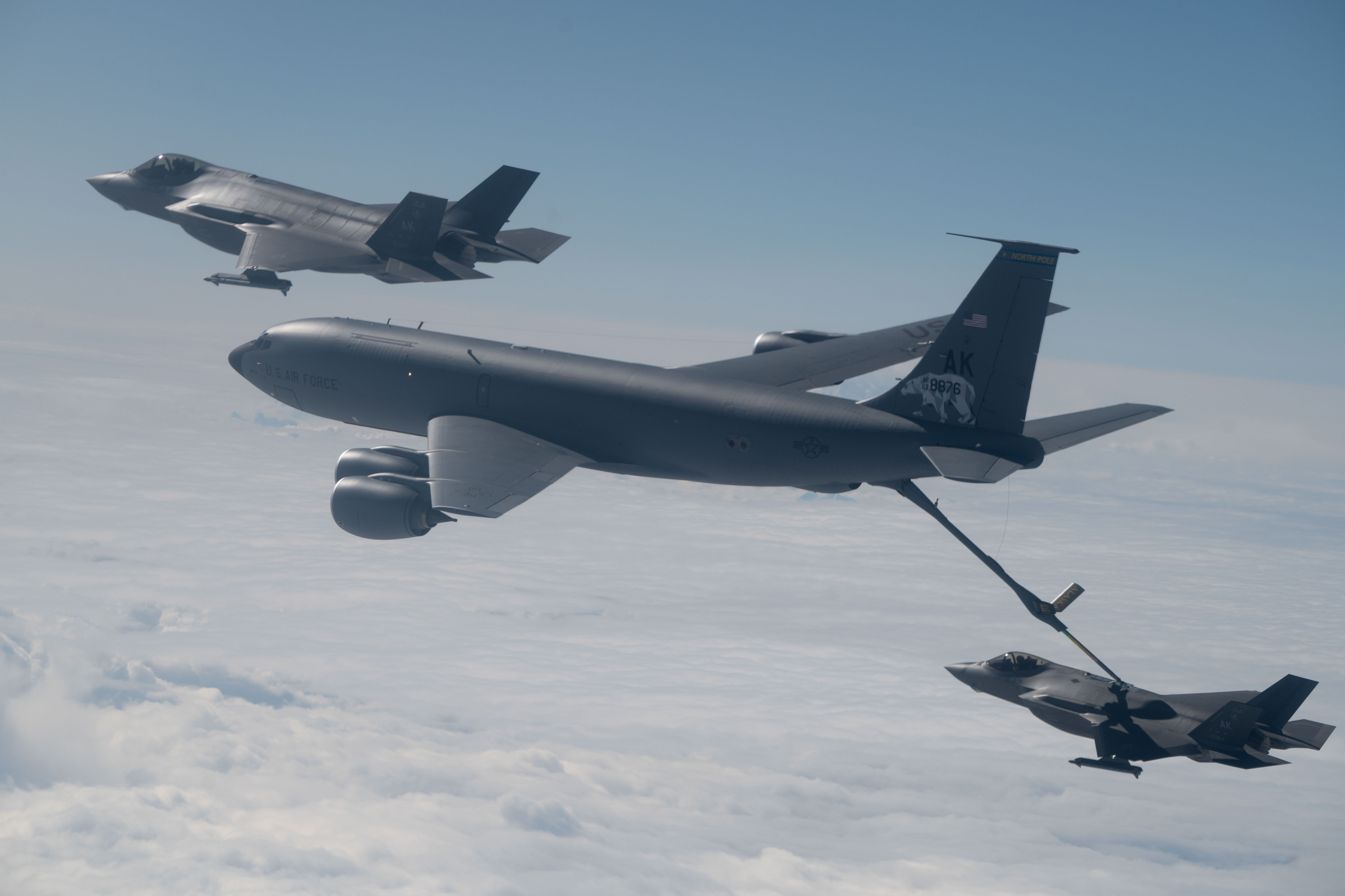 Two F-35A Lightning IIs from Eielson Air Force Base, Alaska, refuel from an Alaska Air National Guard KC-135 Stratotanker 