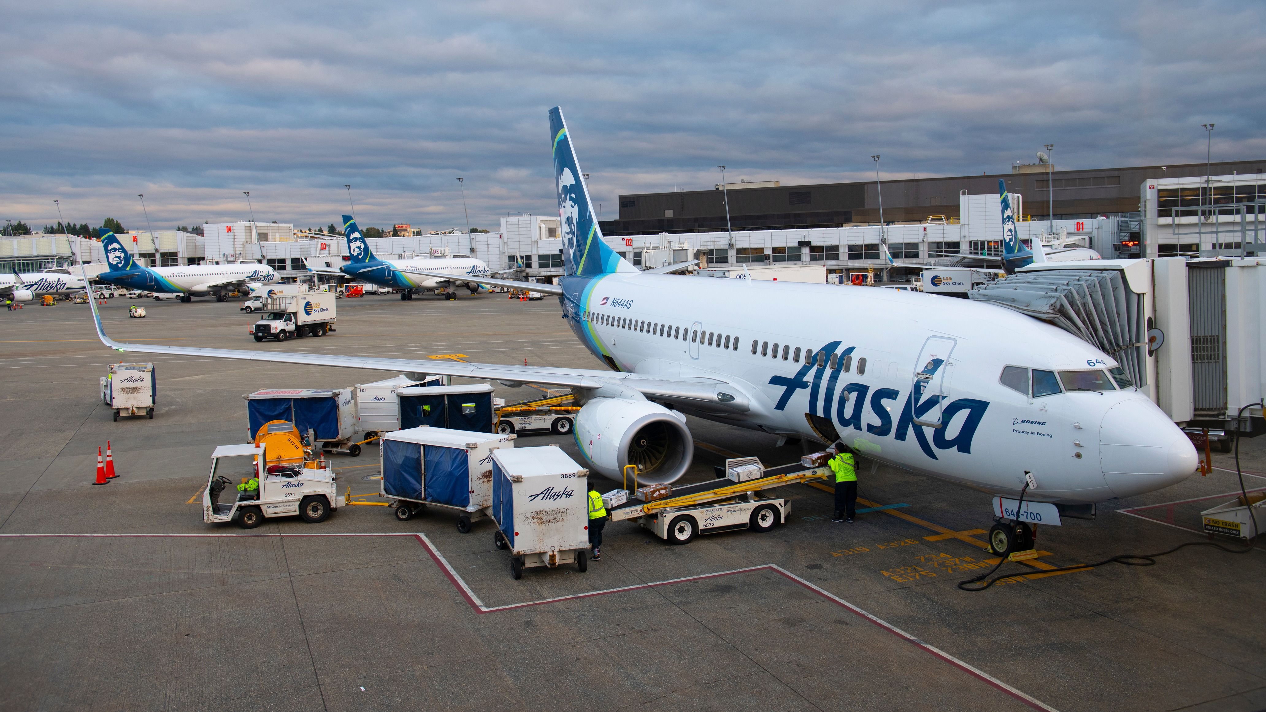 Alaska Airlines Boeing 737-700 parked at a gate at SEA shutterstock_1706501302