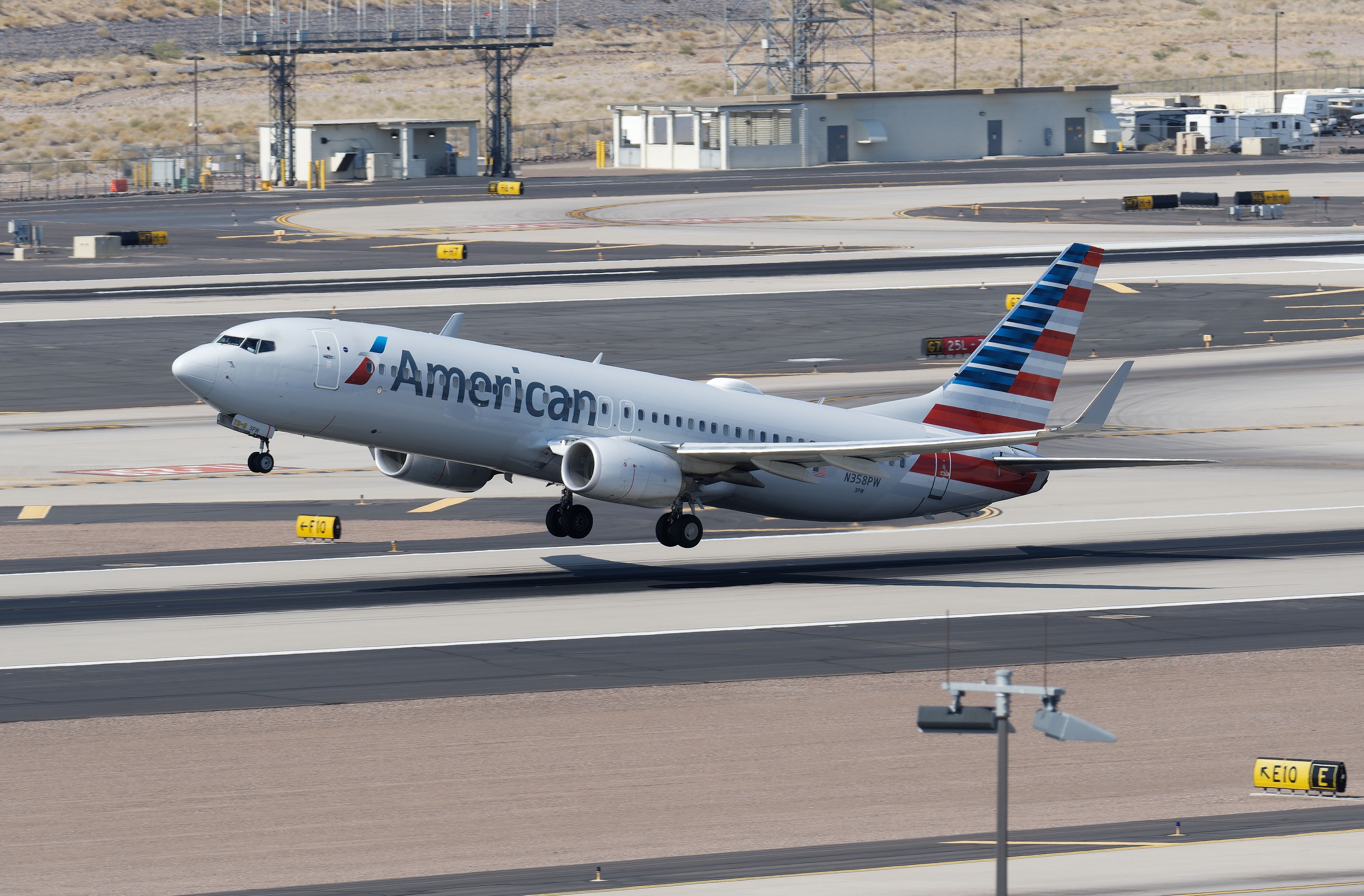 American Airlines Boeing 737-800 taking off from PHX shutterstock_2298277643