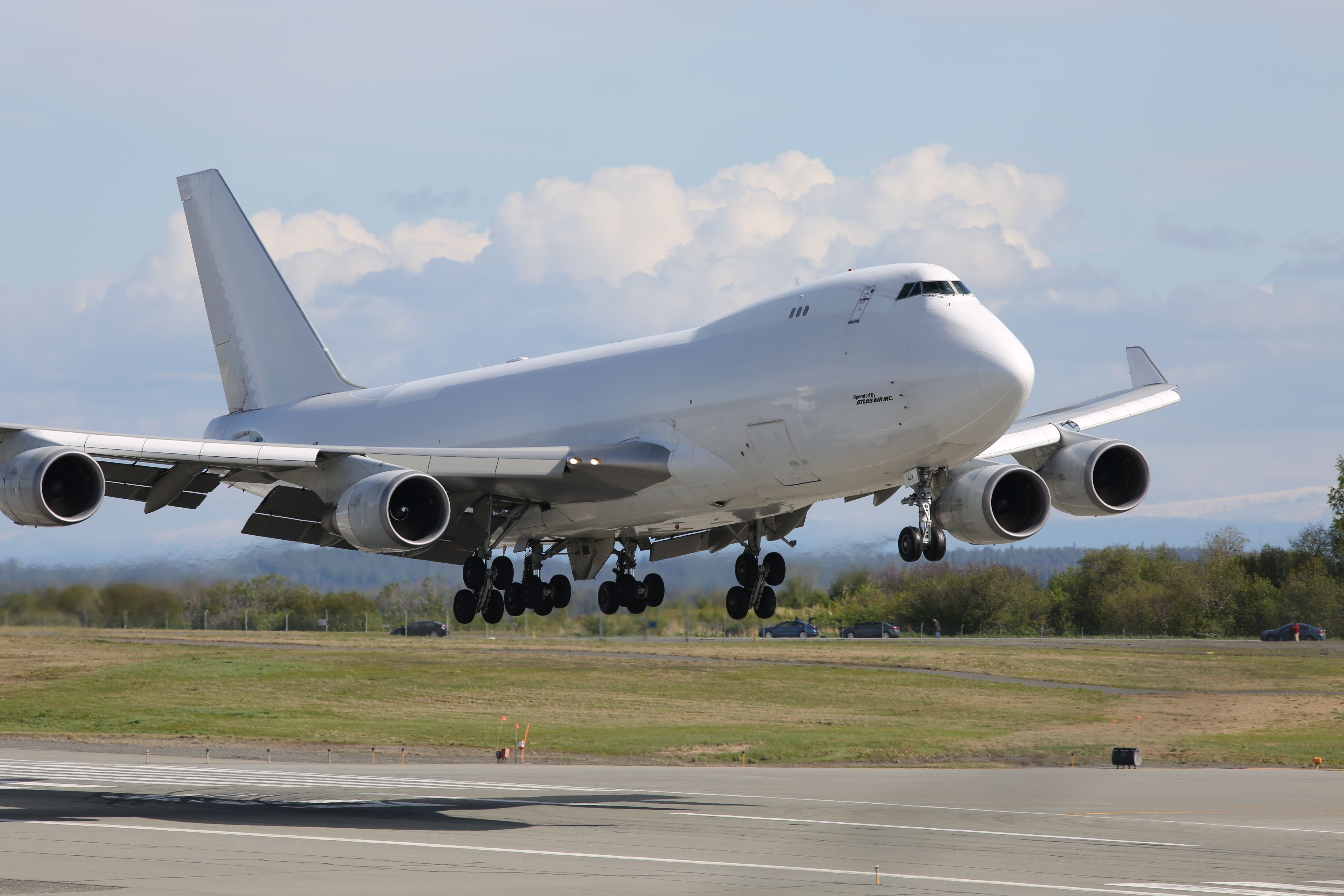 Atlas Air Boeing 747-400F landing on a runway shutterstock_668407474