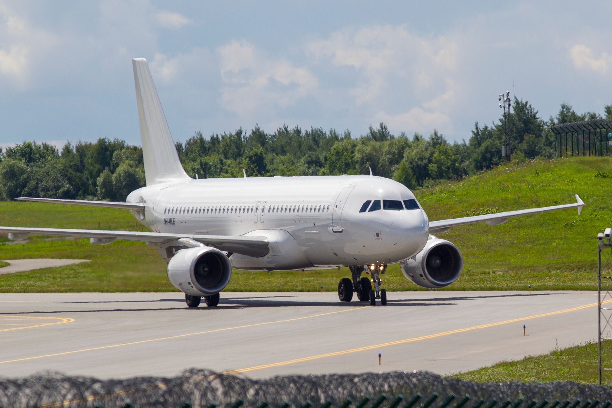 Avion Express Airbus A320 taxiing at Vilnius Airport VNO shutterstock_2199334825