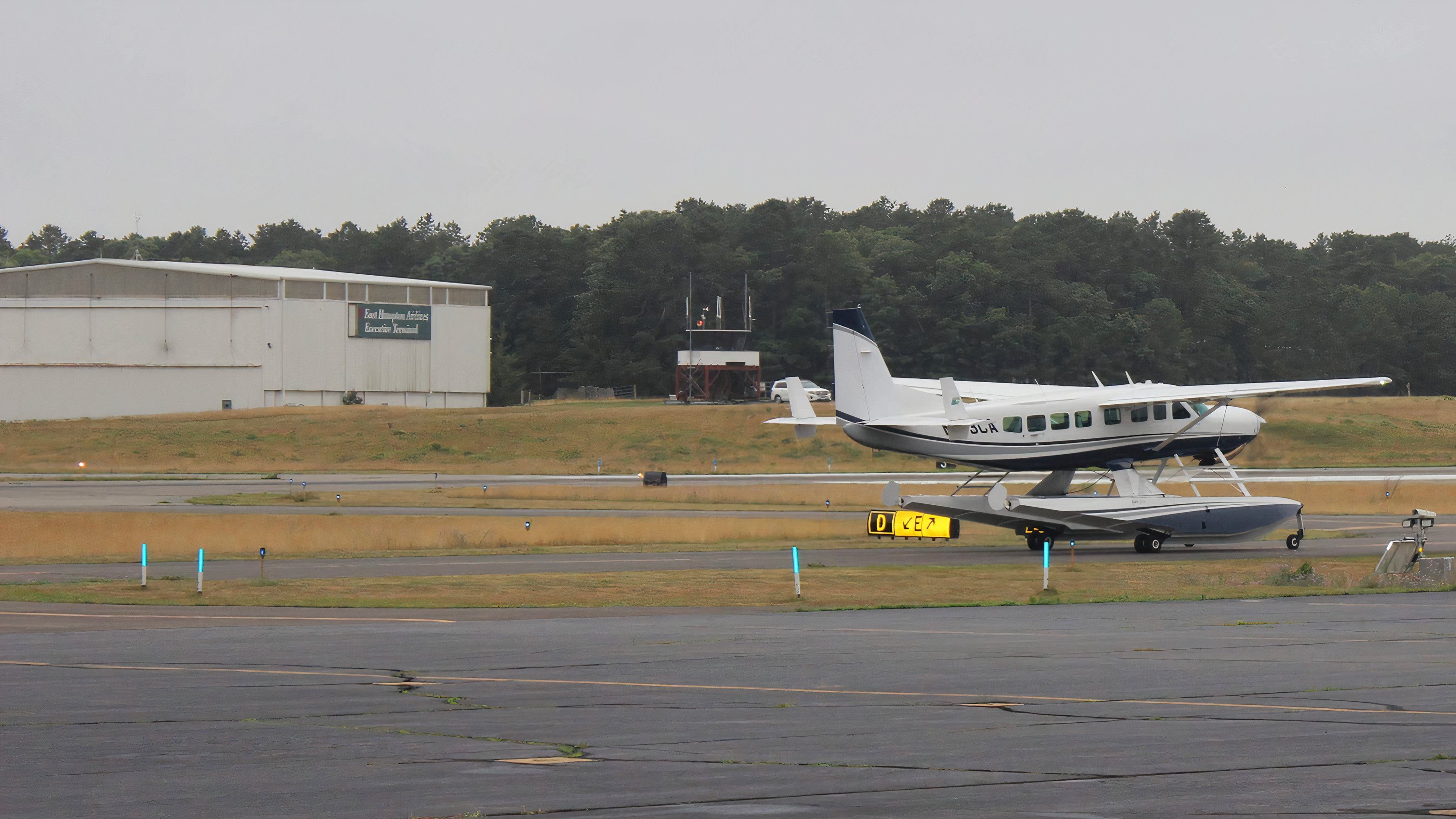 Cessna Caravan in front of East Hampton Airport ATC tower