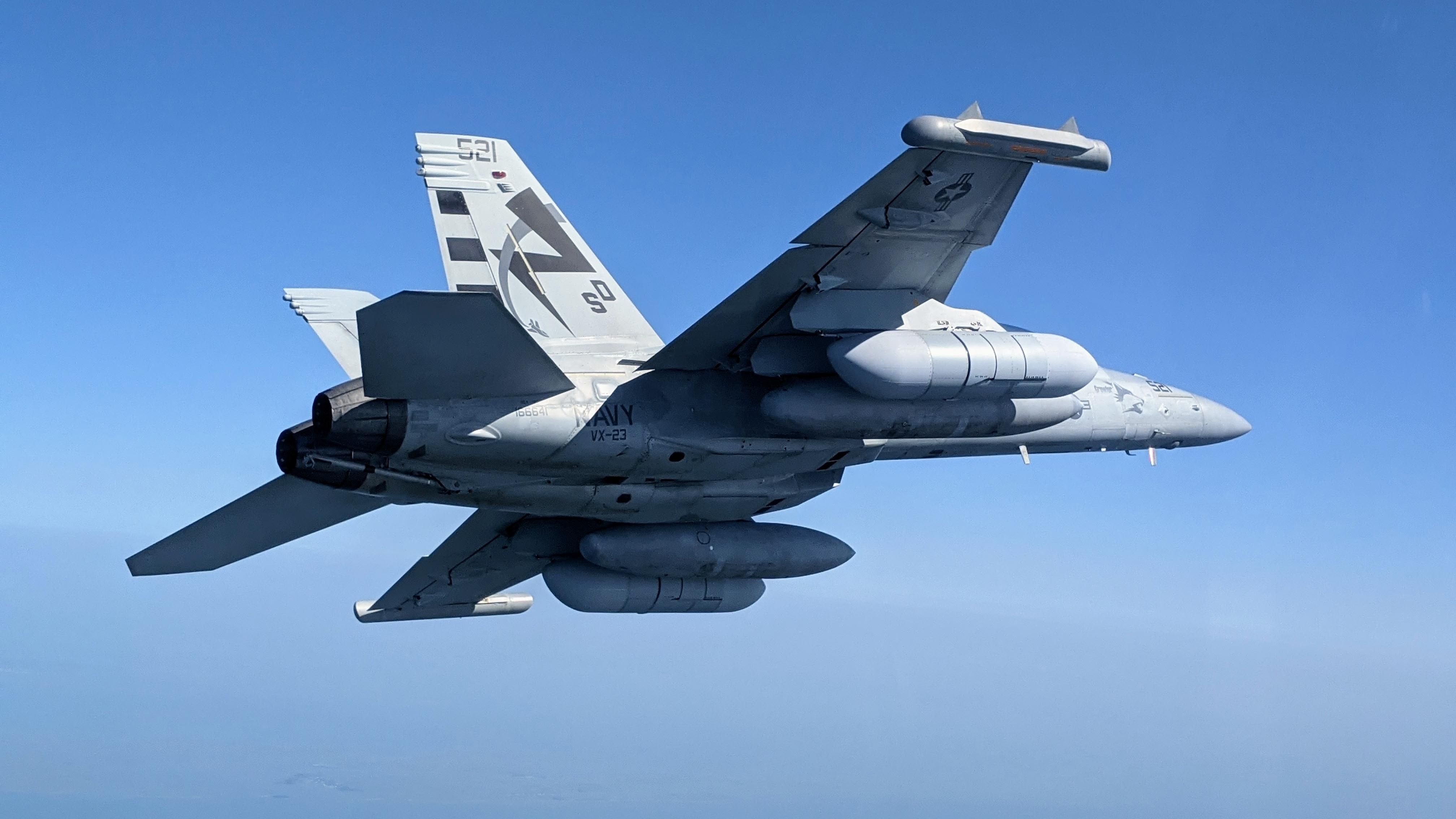 Photo of EA-18G growler in flight as viewed from below