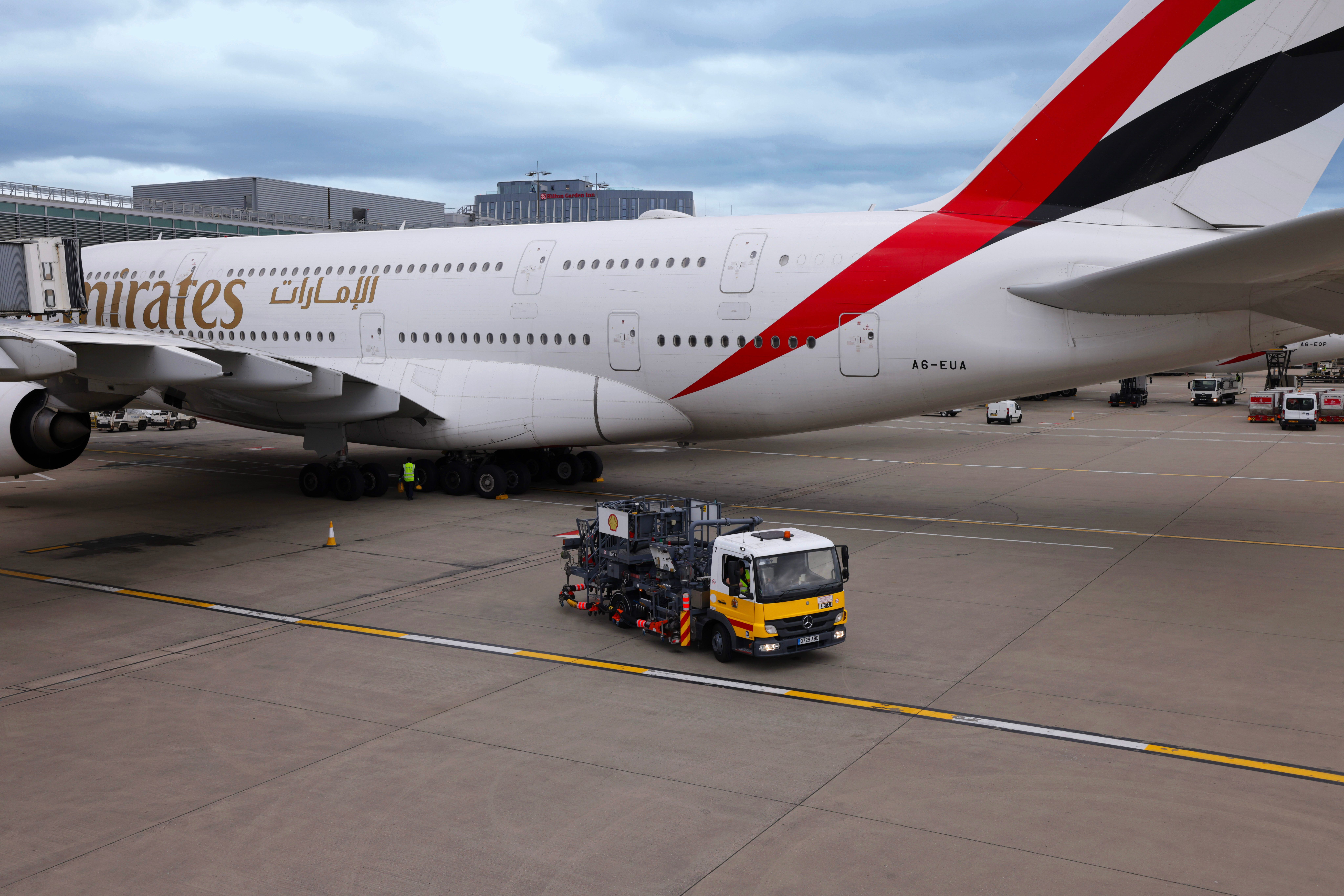 Shell fuel truck next to emirates A380