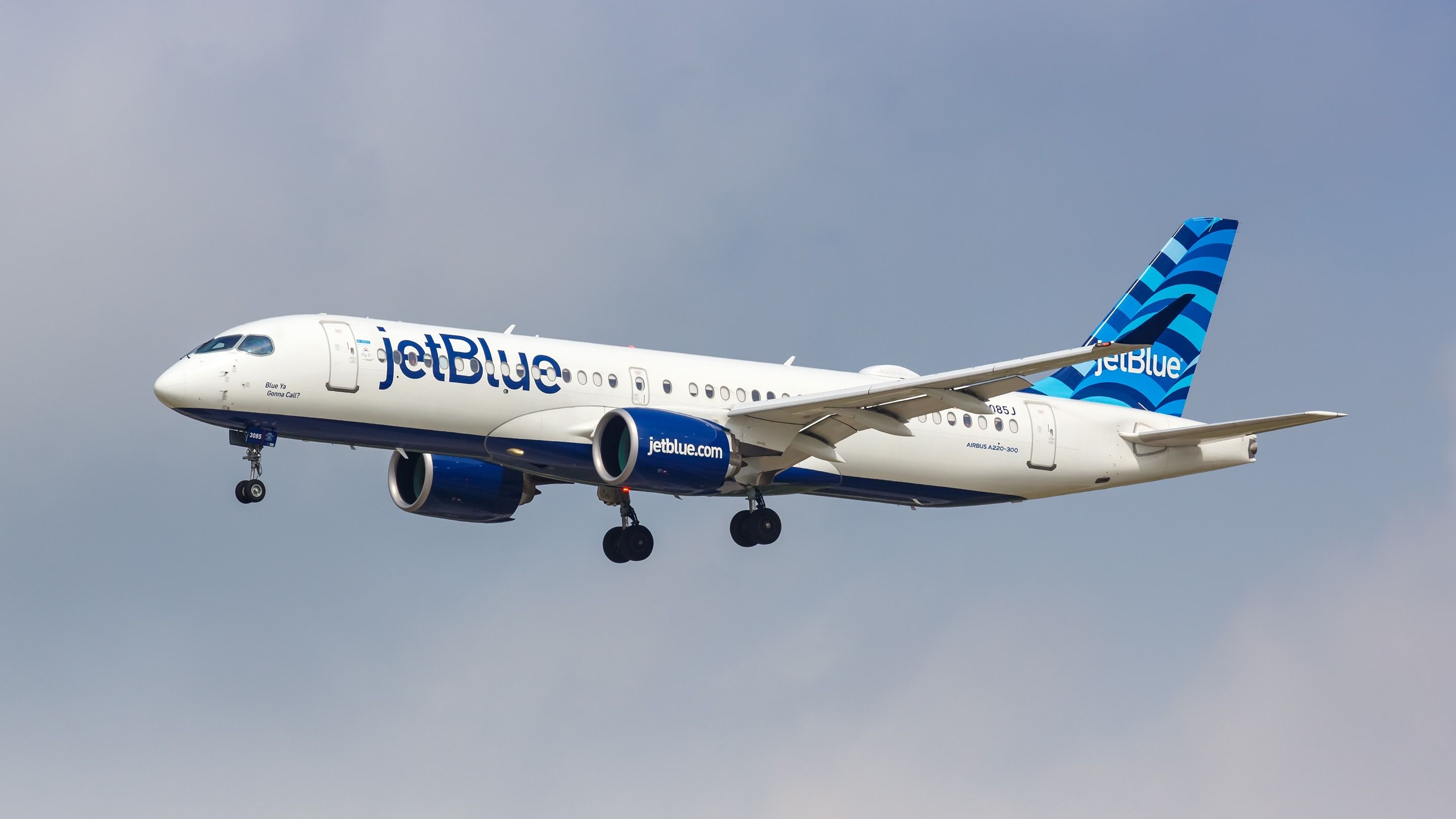 JetBlue Airbus A220-300 landing at DFW shutterstock_2336681681