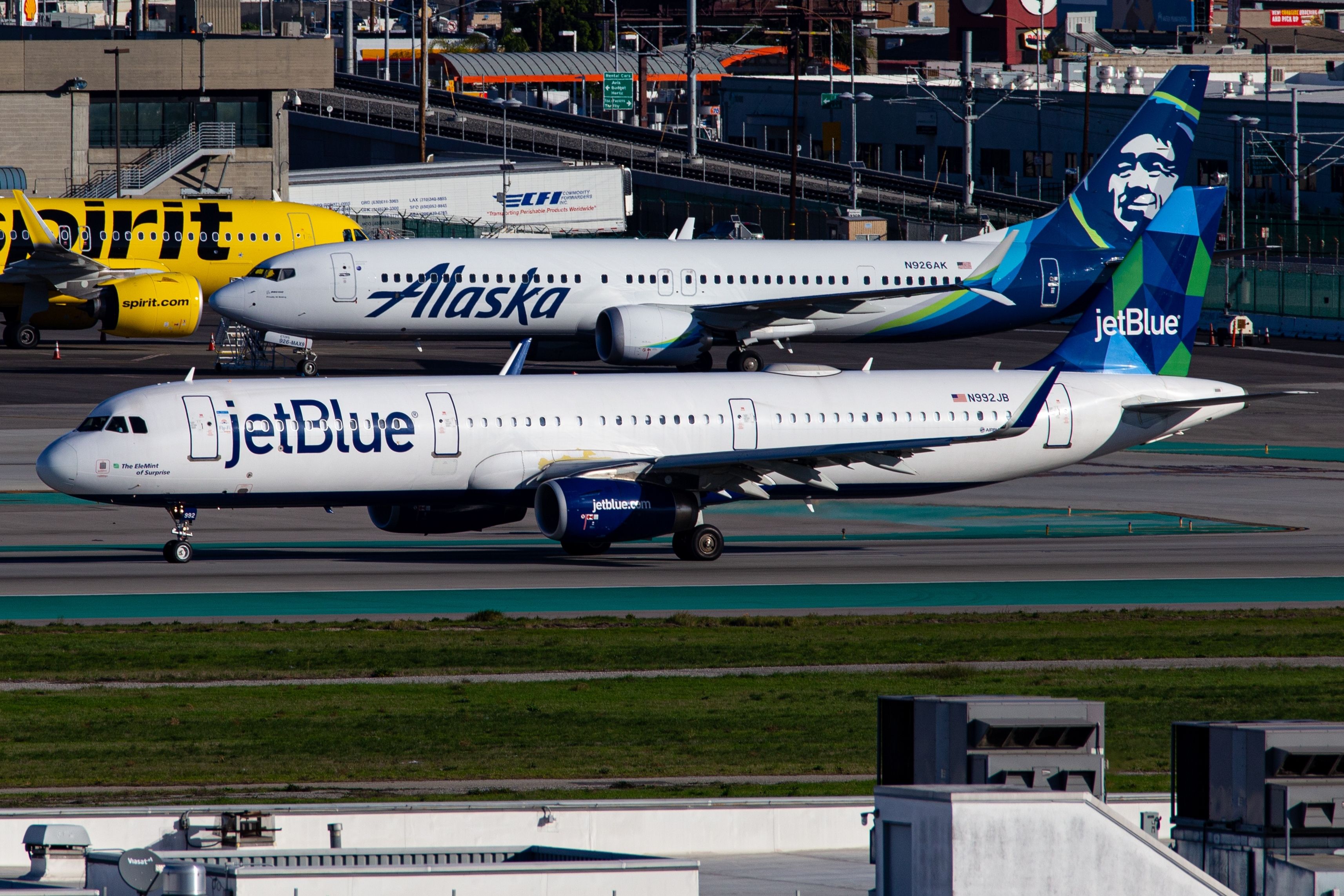 JetBlue, Alaska Airlines, and Spirit Airlines aircraft at LAX shutterstock_2453240129