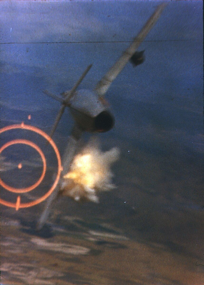 A North Vietnamese Mikoyan-Gurevich MiG-17 is hit by 20 mm shells from a U.S. Air Force Republic F-105D Thunderchief piloted by Major Ralph Kuster Jr.