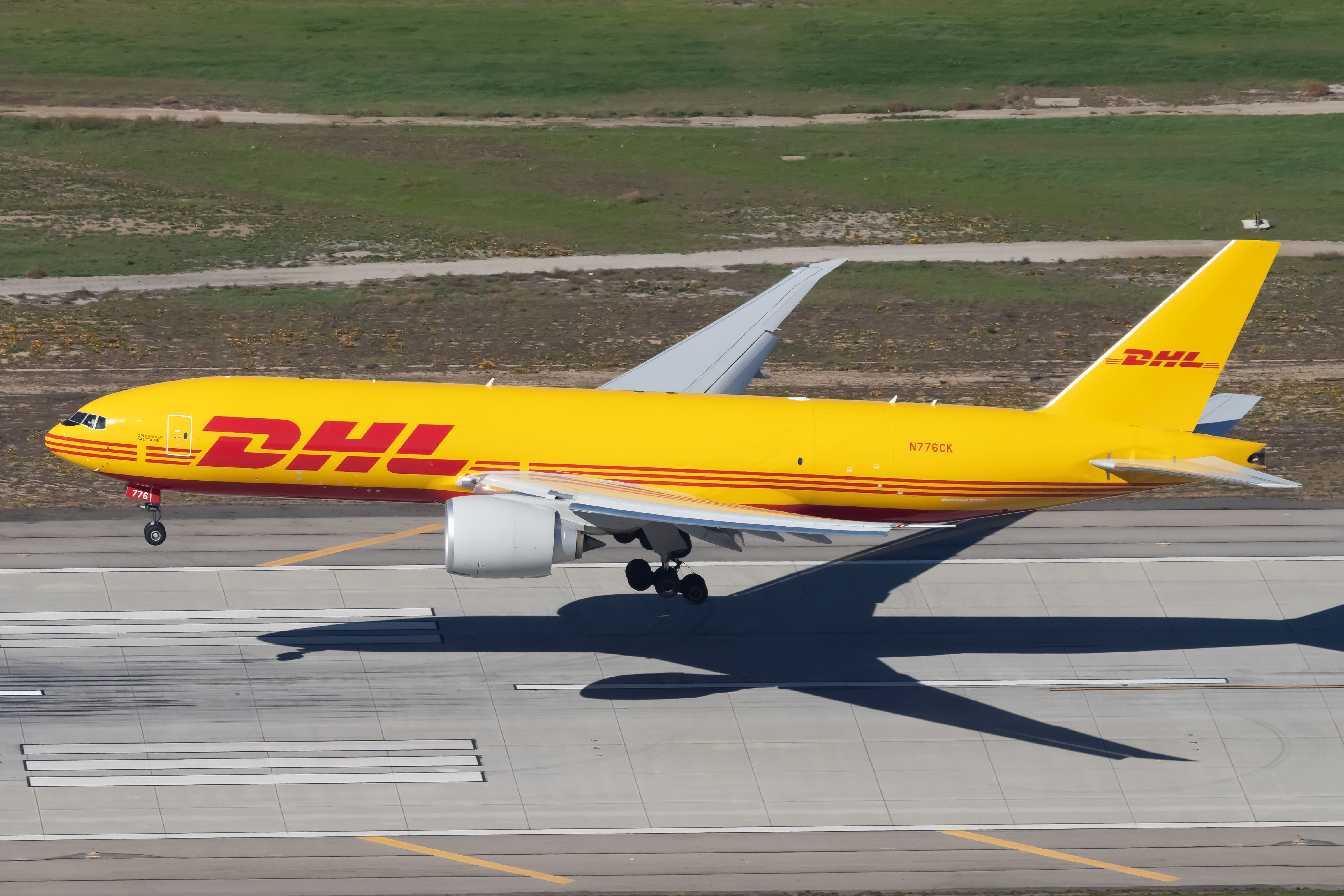 A DHL Boeing 777F landing.