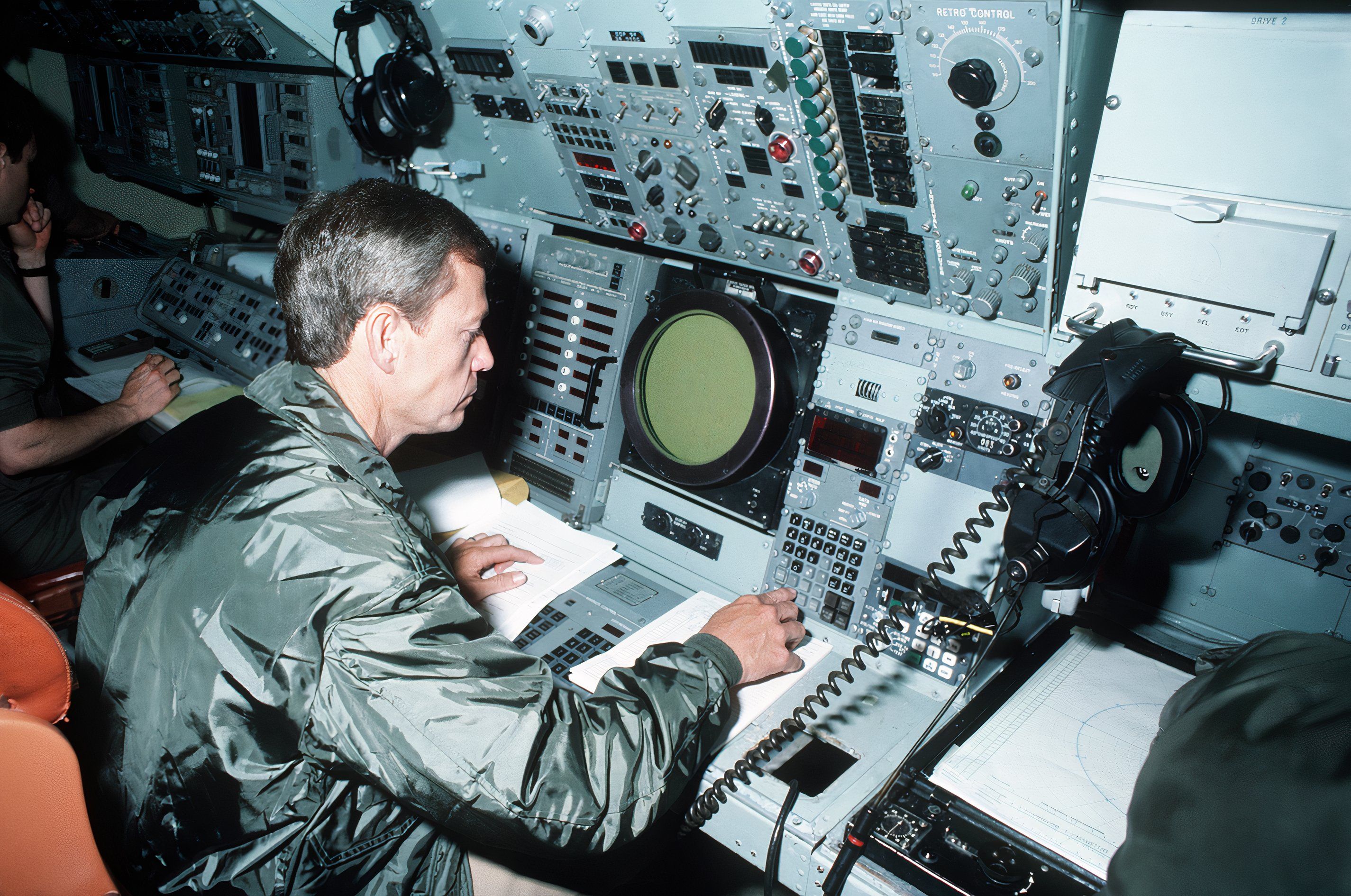 Photo of a Weapons Officer aboard P-3 Orion