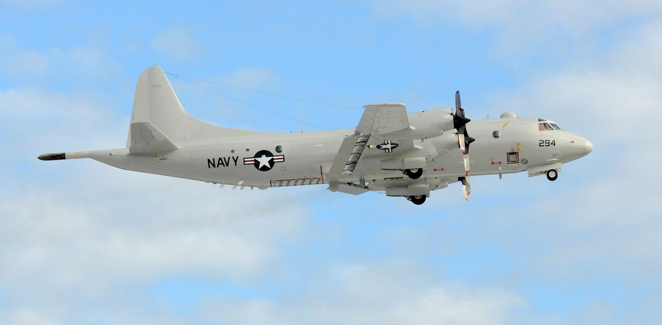 Photo of US Navy P-3 in flight as viewed from the side