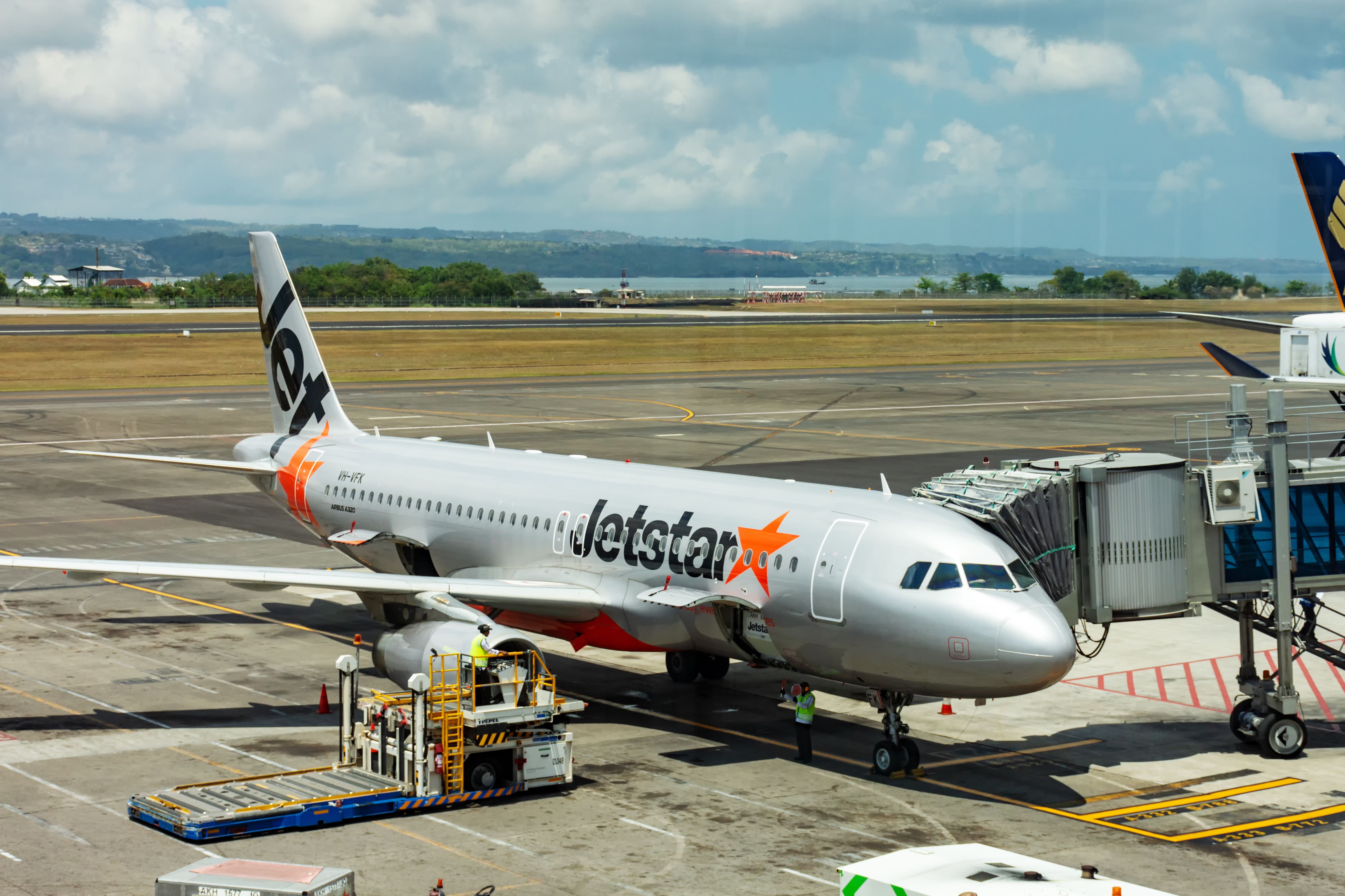 Denpasar, Indonesia - September 19, 2018: Jetstar Airways airplane boarded at tarmac in Bali Ngurah Rai international airport. It is an Australian low-cost airline headquartered in Melbourne.
