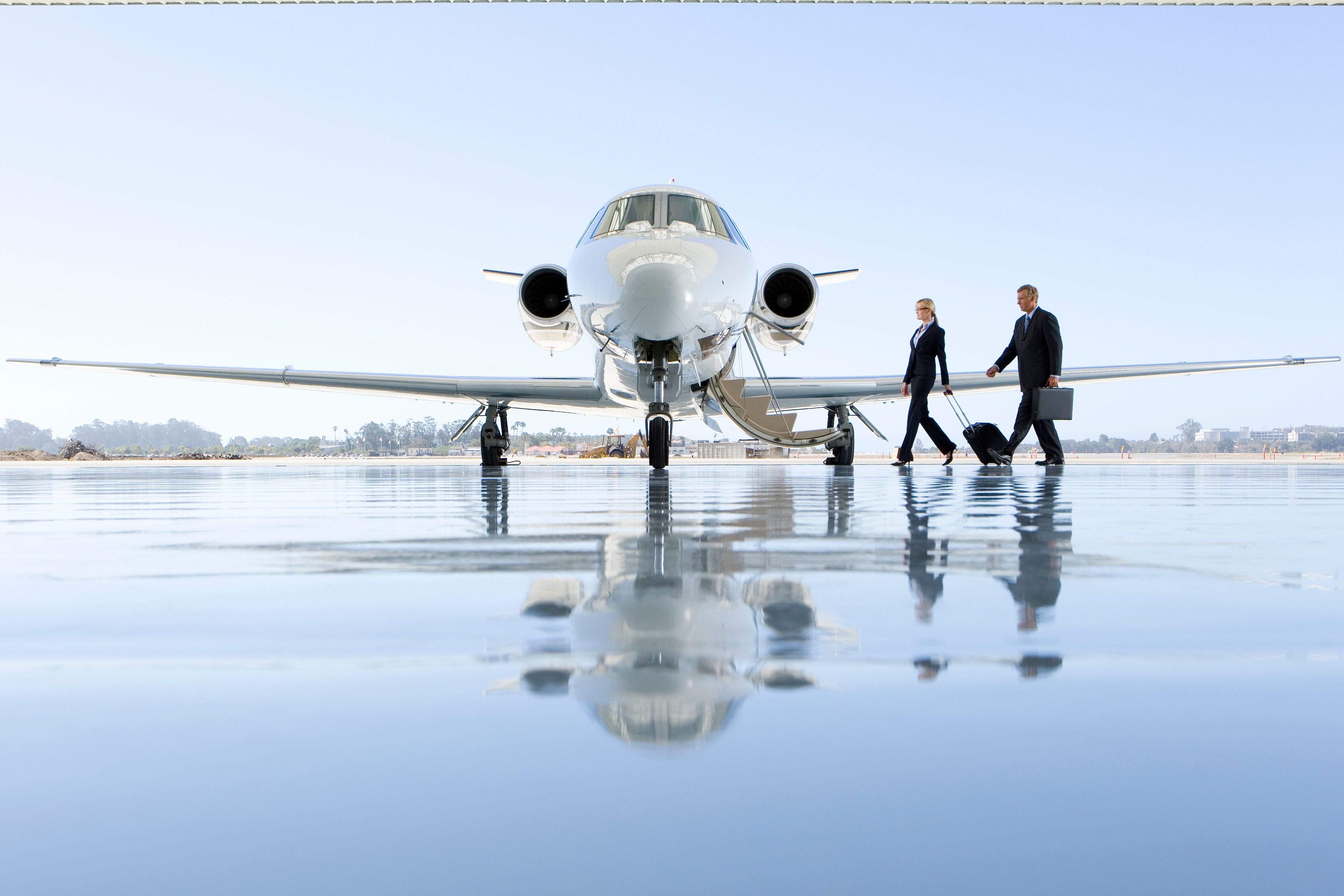 Cabin crew and pilot boarding private jet