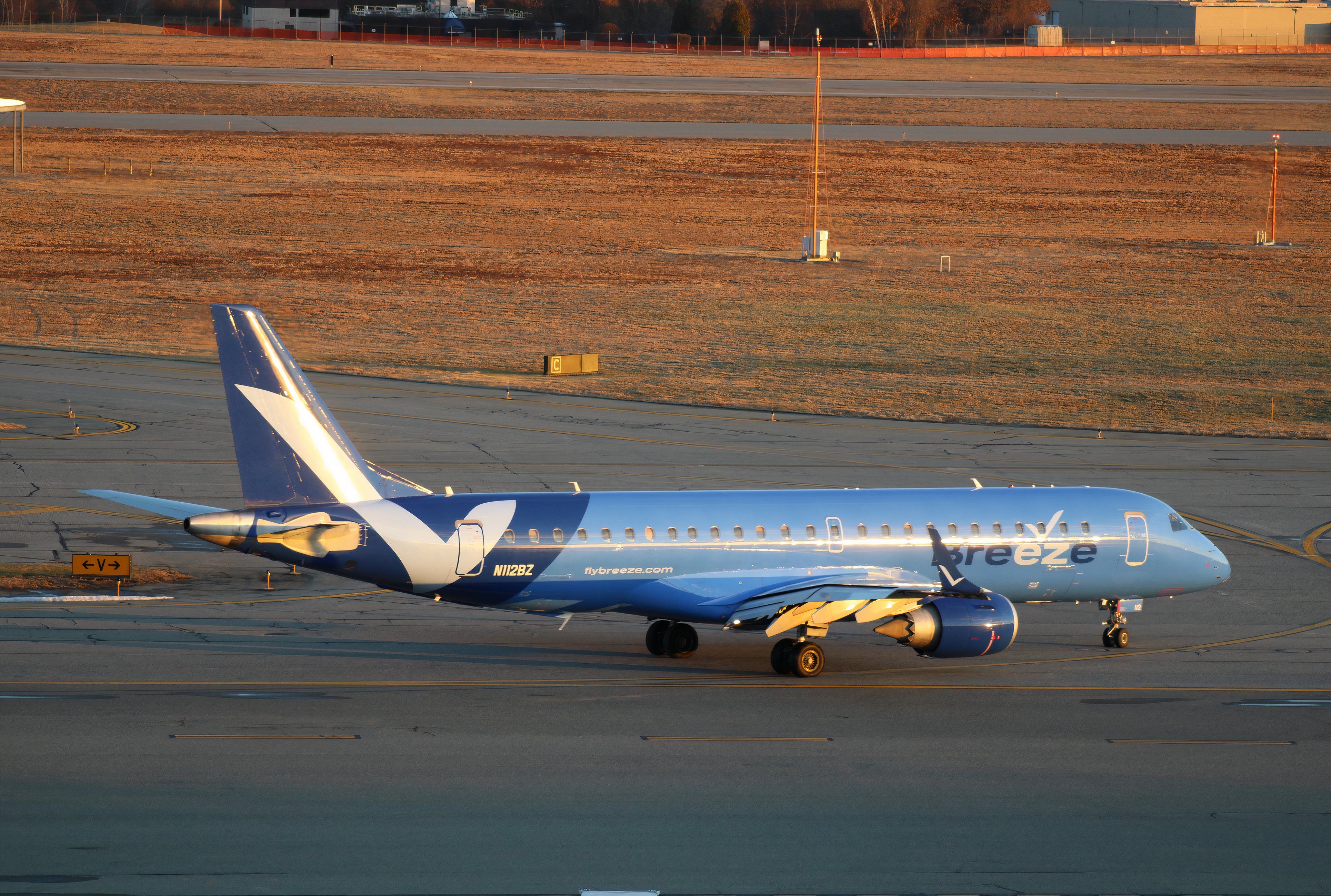 A Breeze Airways E-190 regional jet at  Rhode Island T.F. Green International Airport (PVD) in Providence, Rhode Island, USA - October 26, 2021