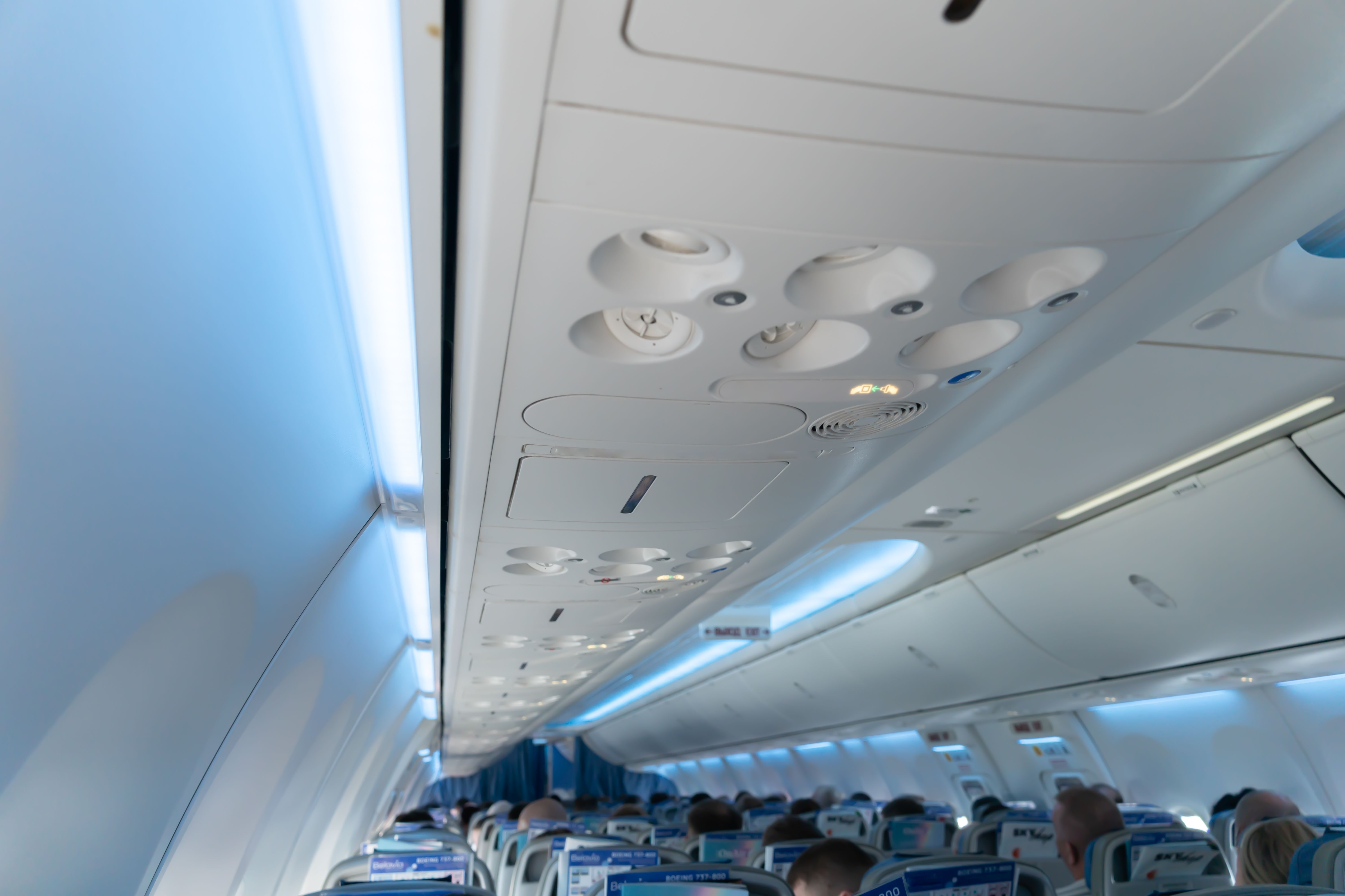 Console panel in a aircraft fuselage cabin. The air condition and light on plane panel above passengers. lamp above the low cost airline seat