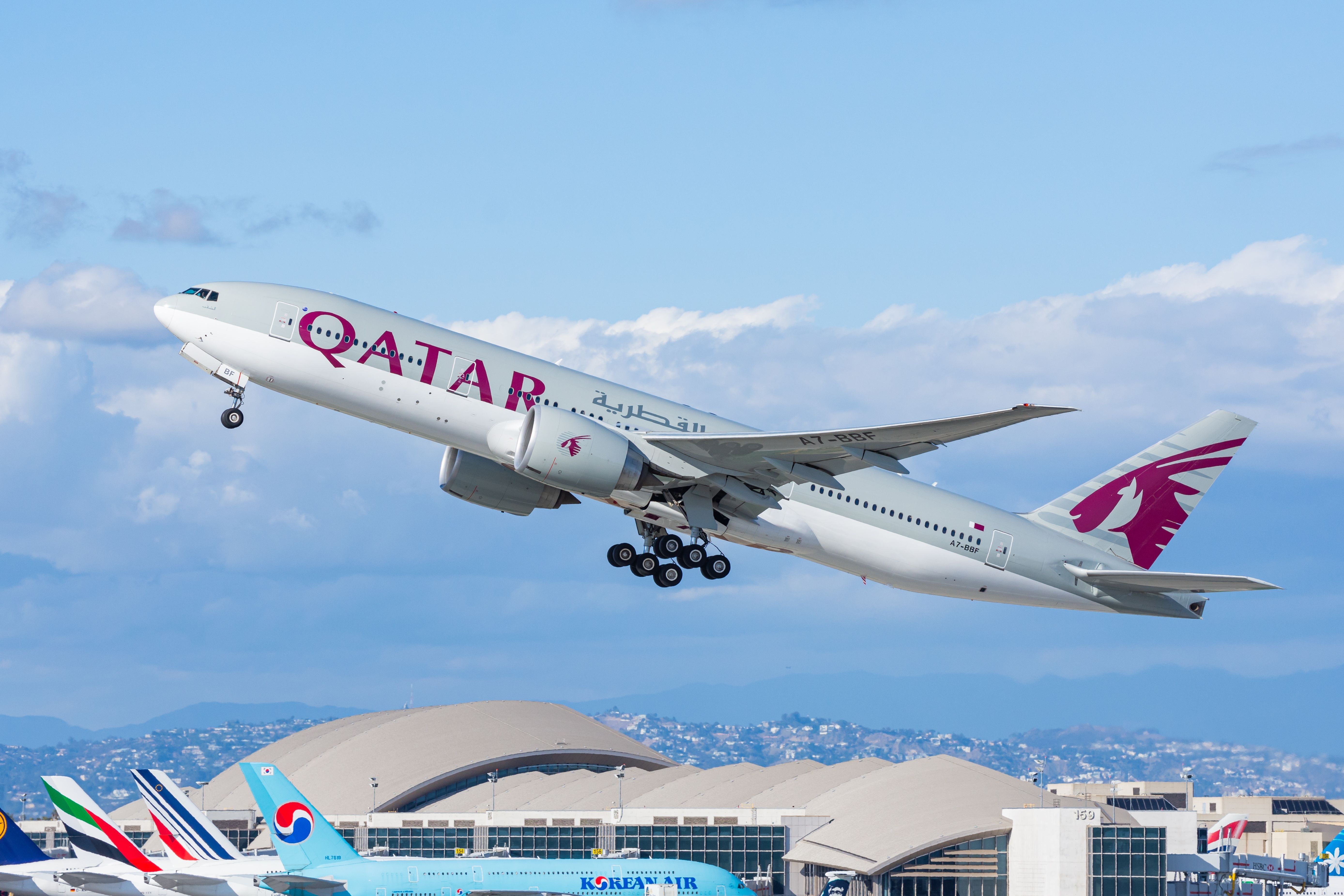 Qatar Airways Boeing 777 is taking off from Los Angeles International Airport (LAX), heading towards its destination in Doha