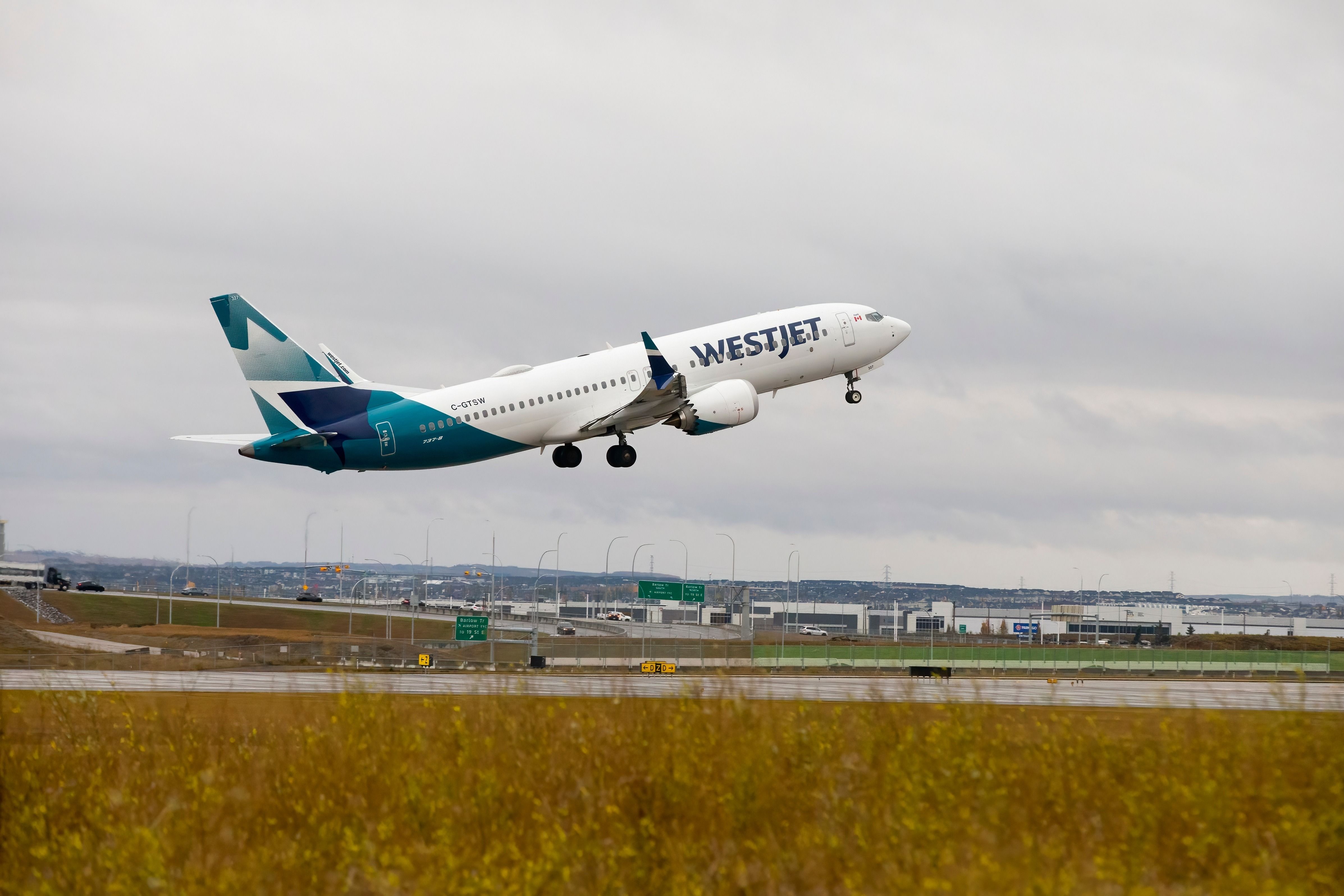WestJet Boeing 737 MAX 8 departing from Calgary International Airport.